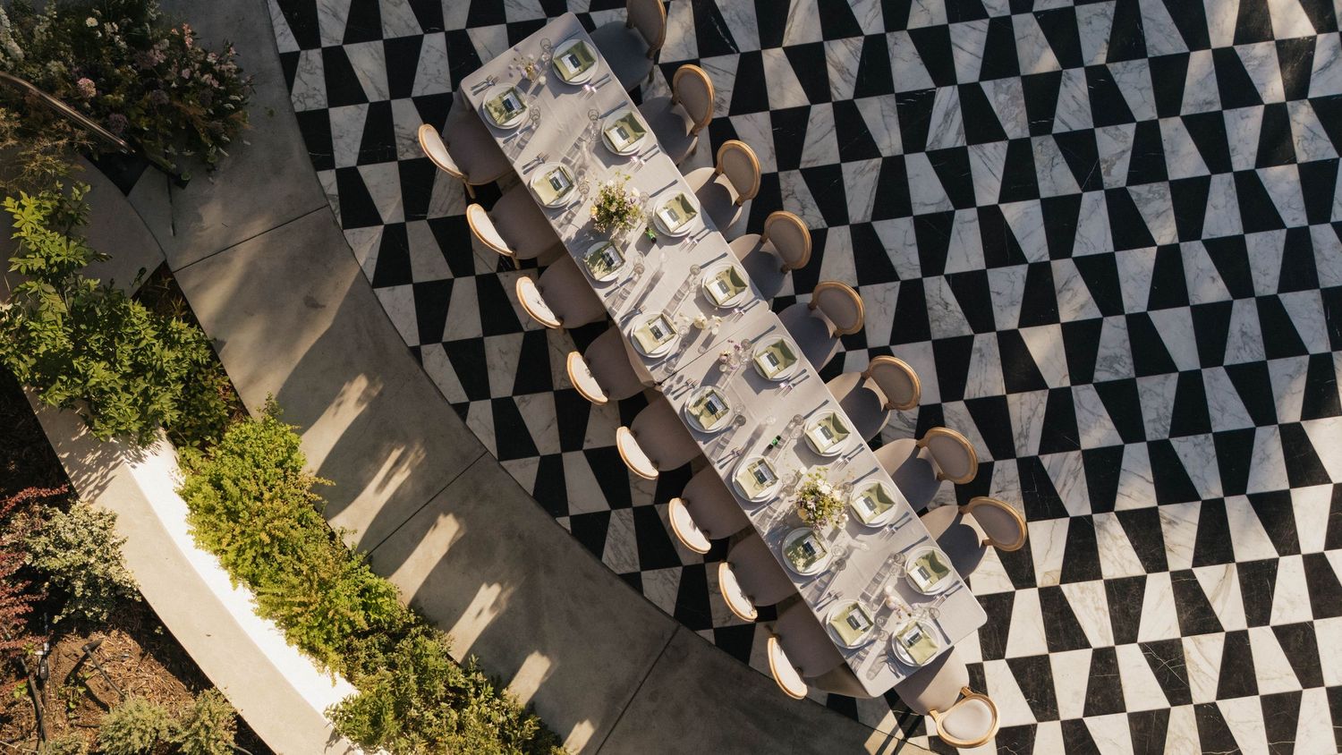 An overhead view of a black and white checkered floor pattern at an outdoor venue.