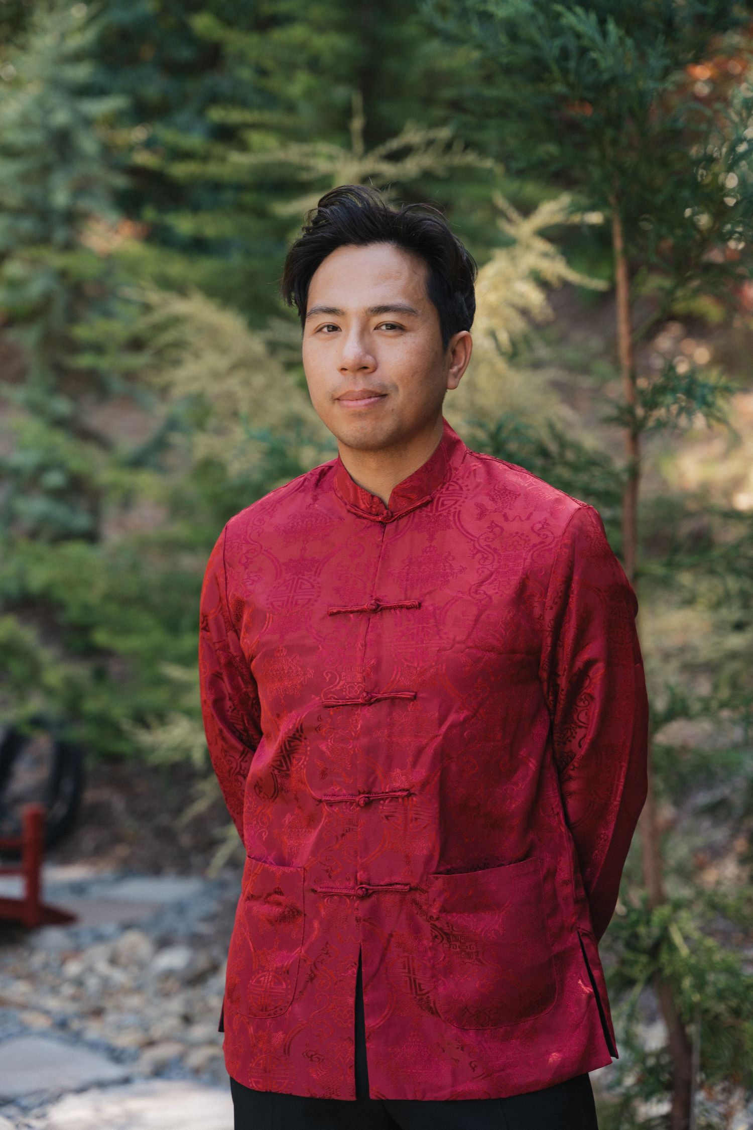 Series of photos showing a person in a traditional red Chinese mandarin collar jacket against a natural backdrop.