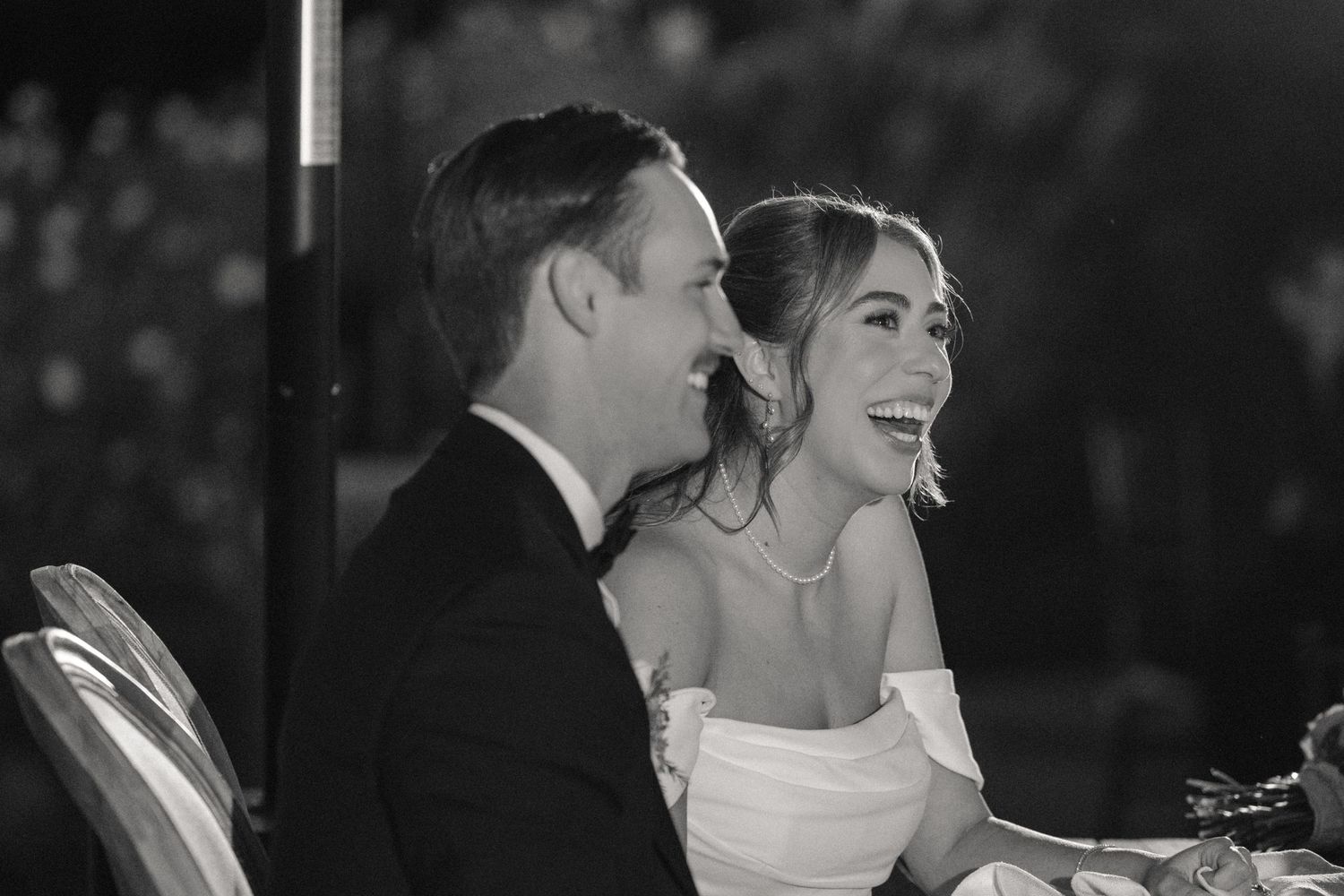 Black and white candid moments of wedding celebration with joyful expressions.