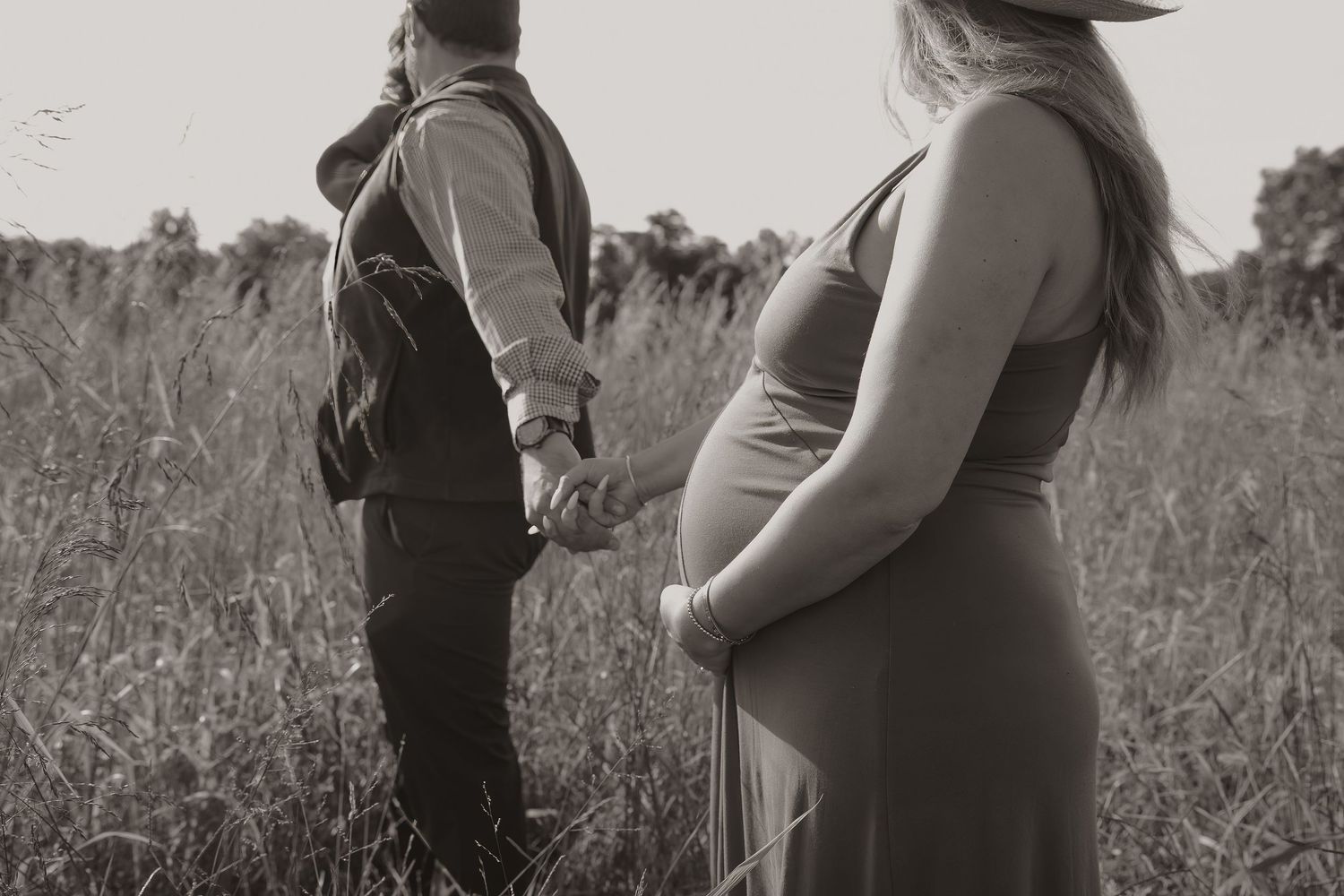 Black-and-white maternity walk through field | Northern Virginia maternity portraits