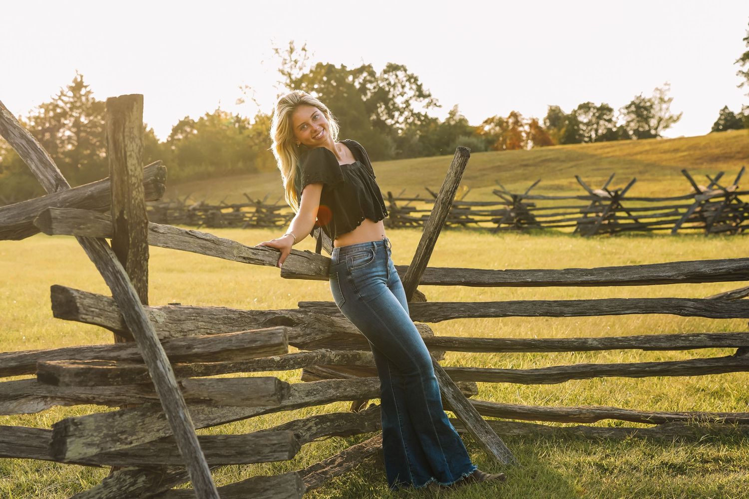Portrait on rustic split-rail fence at sunset in Northern Virginia countryside | lifestyle portraits.