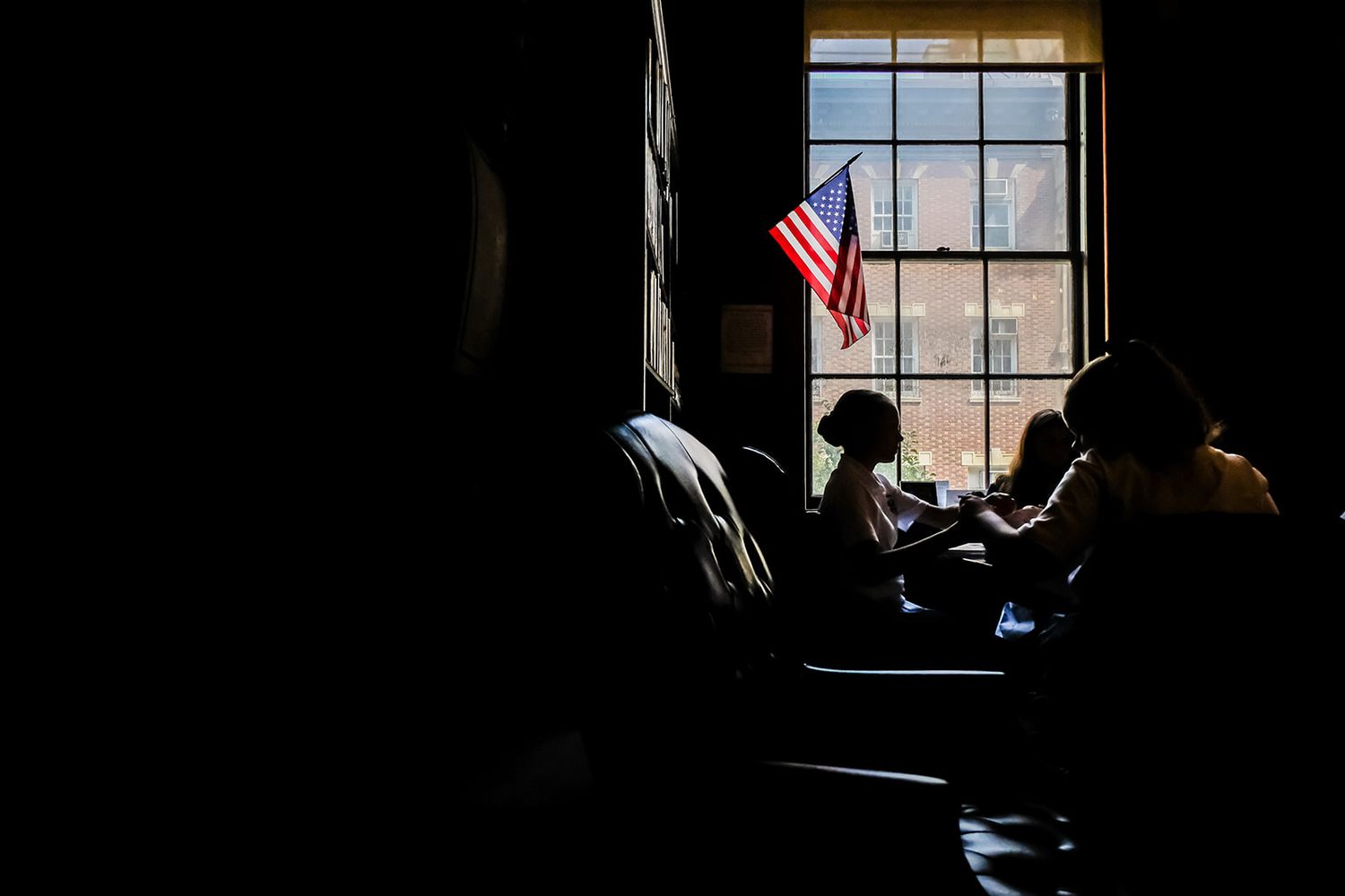student at desk with American flag  | HIGHER EDUCATION PHOTOGRAPHER, UNIVERSITY PHOTOGRAPHER, COMMERCIAL PHOTOGRAPHER