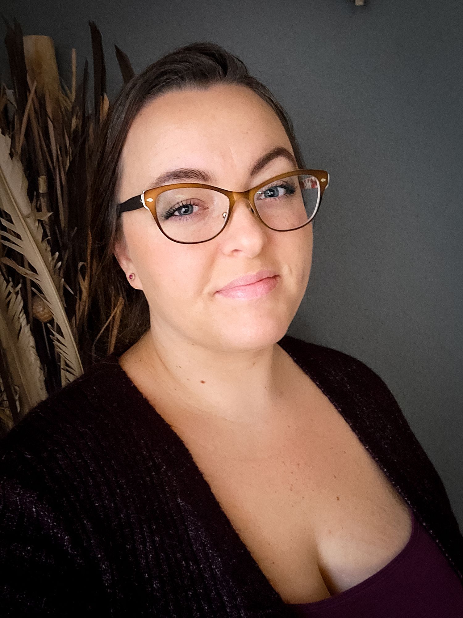Tina Marie from Tina Marie Photography invitingly smiling in a professionally taken image.