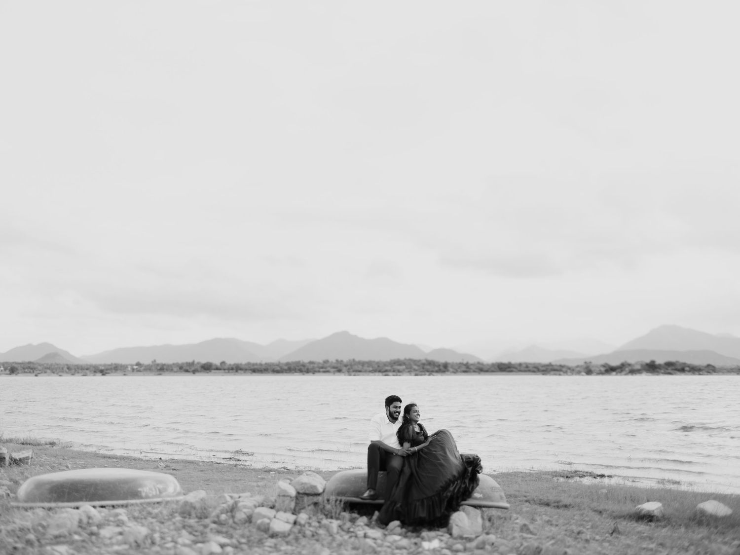 A series of black and white landscape photographs showing mountains, water, and natural scenery.