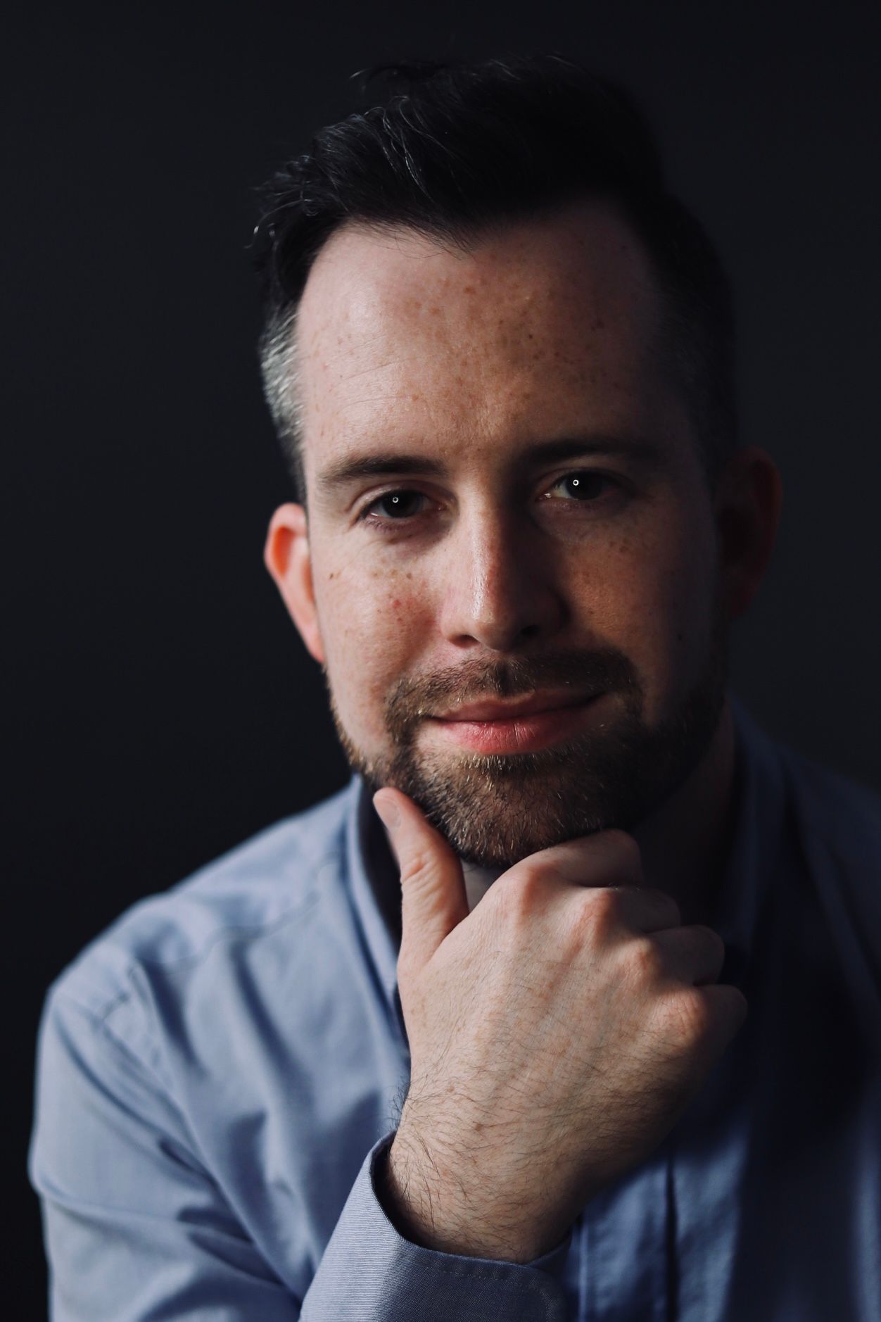 Moody portrait sequence showing contemplative expressions in dim lighting.