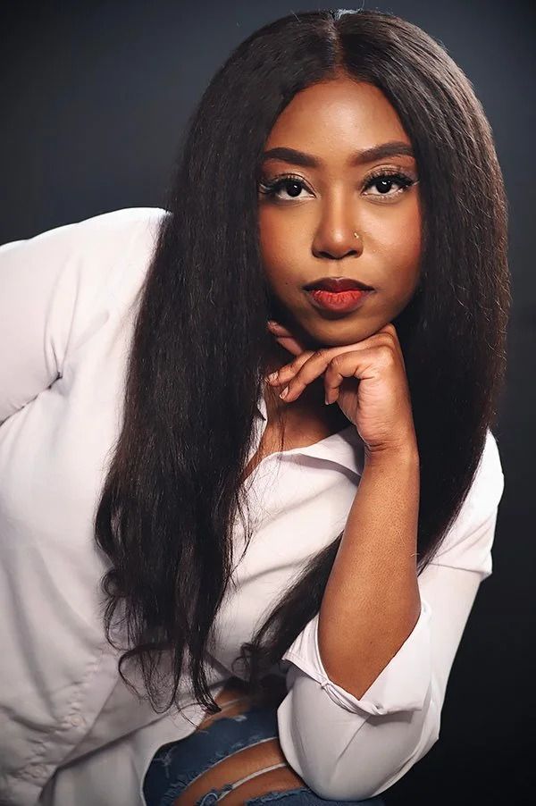 Professional studio portraits in white attire against dark background.