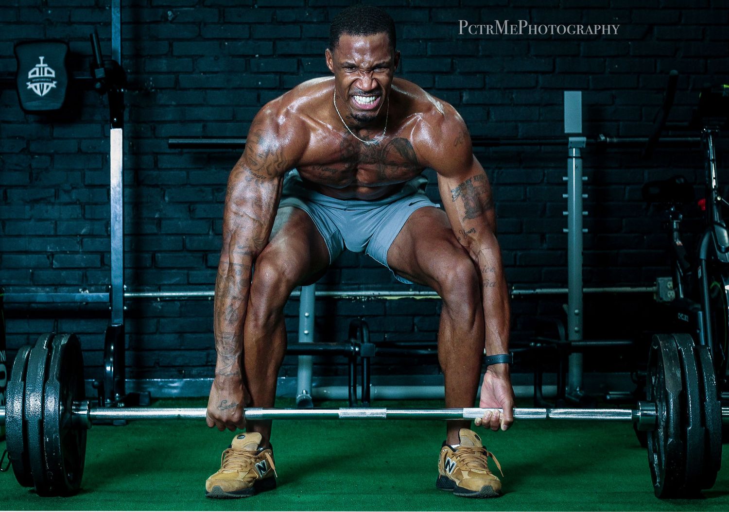 Athletic branding portrait of a muscular man deadlifting a barbell in a gym, capturing strength and determination
