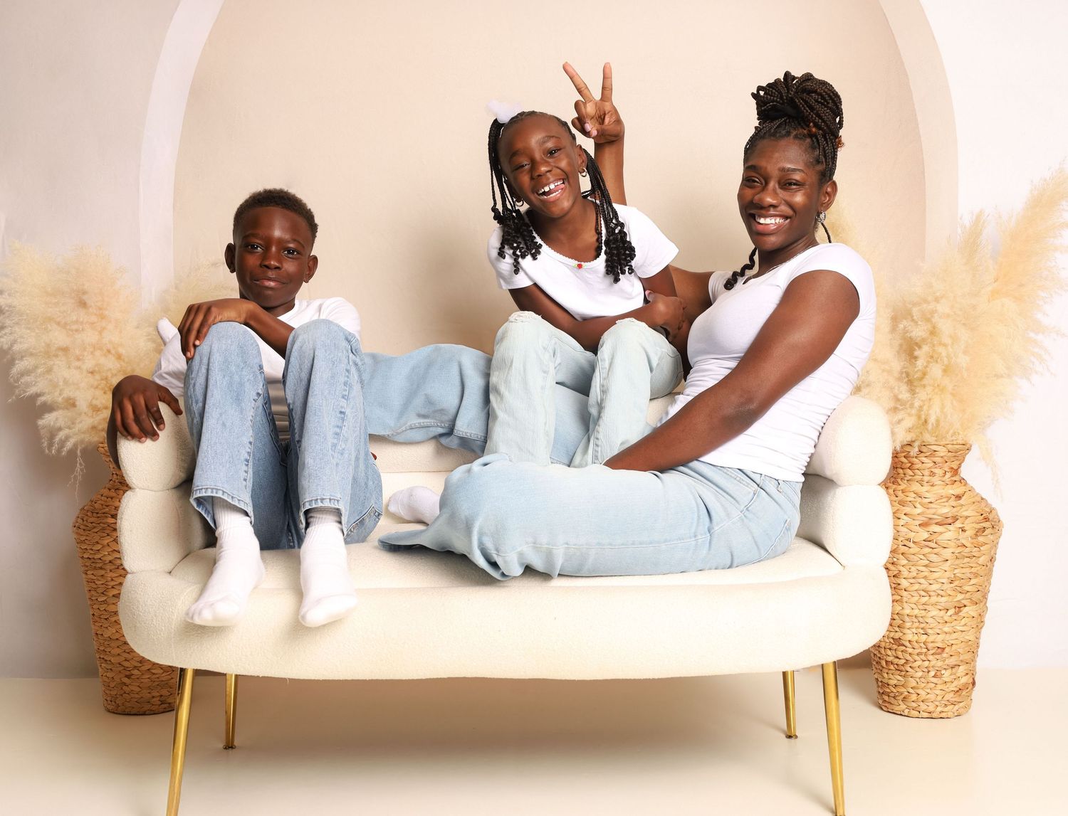 Candid family portrait of a mother and her children sharing a joyful moment together