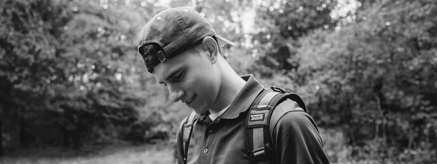 Candid black and white photo of Joshua McLean in an outdoor setting.