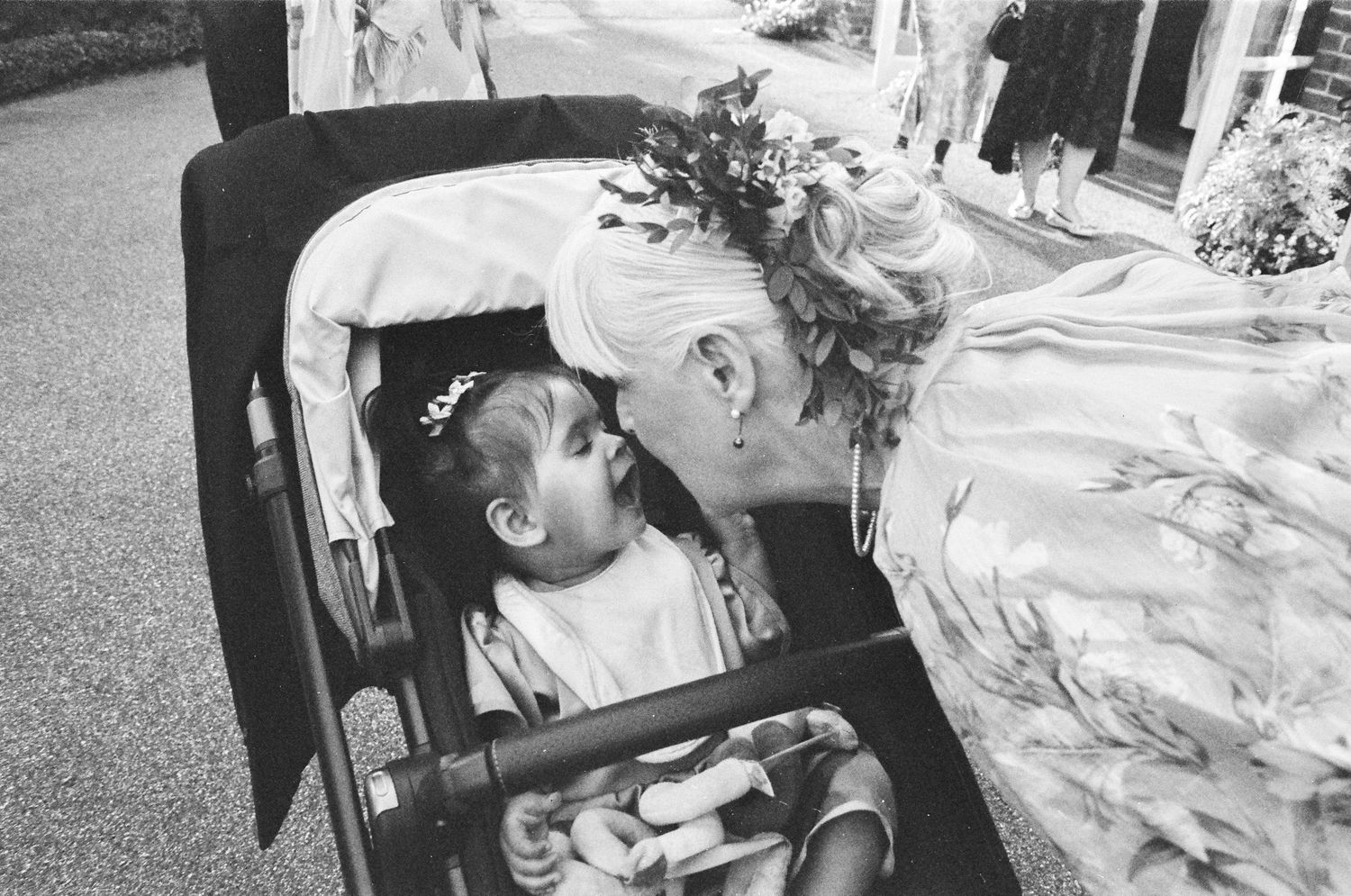 Black and white wedding photography sequence showing candid moments and preparations.