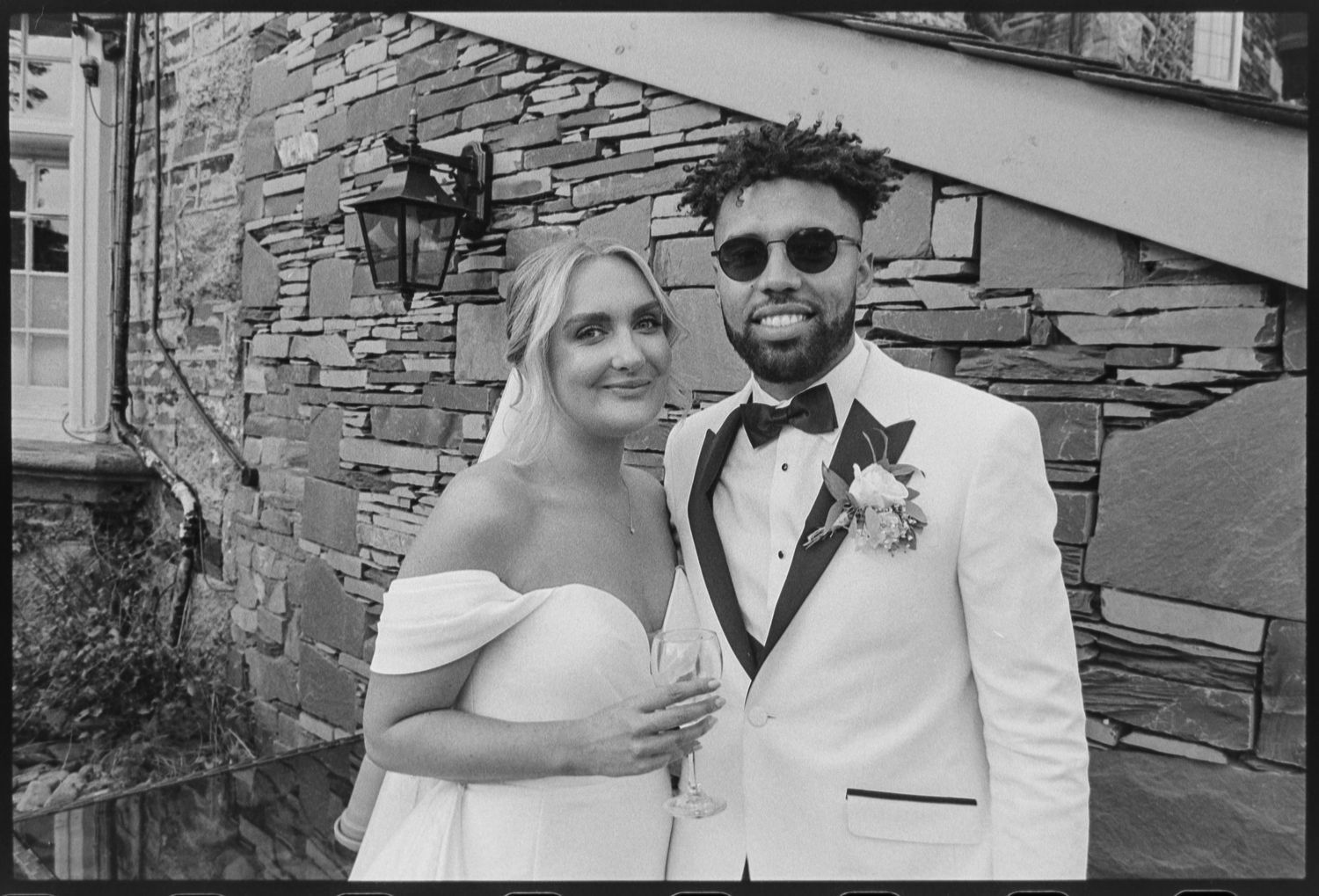Bride and groom share candid moments during their outdoor photo session.