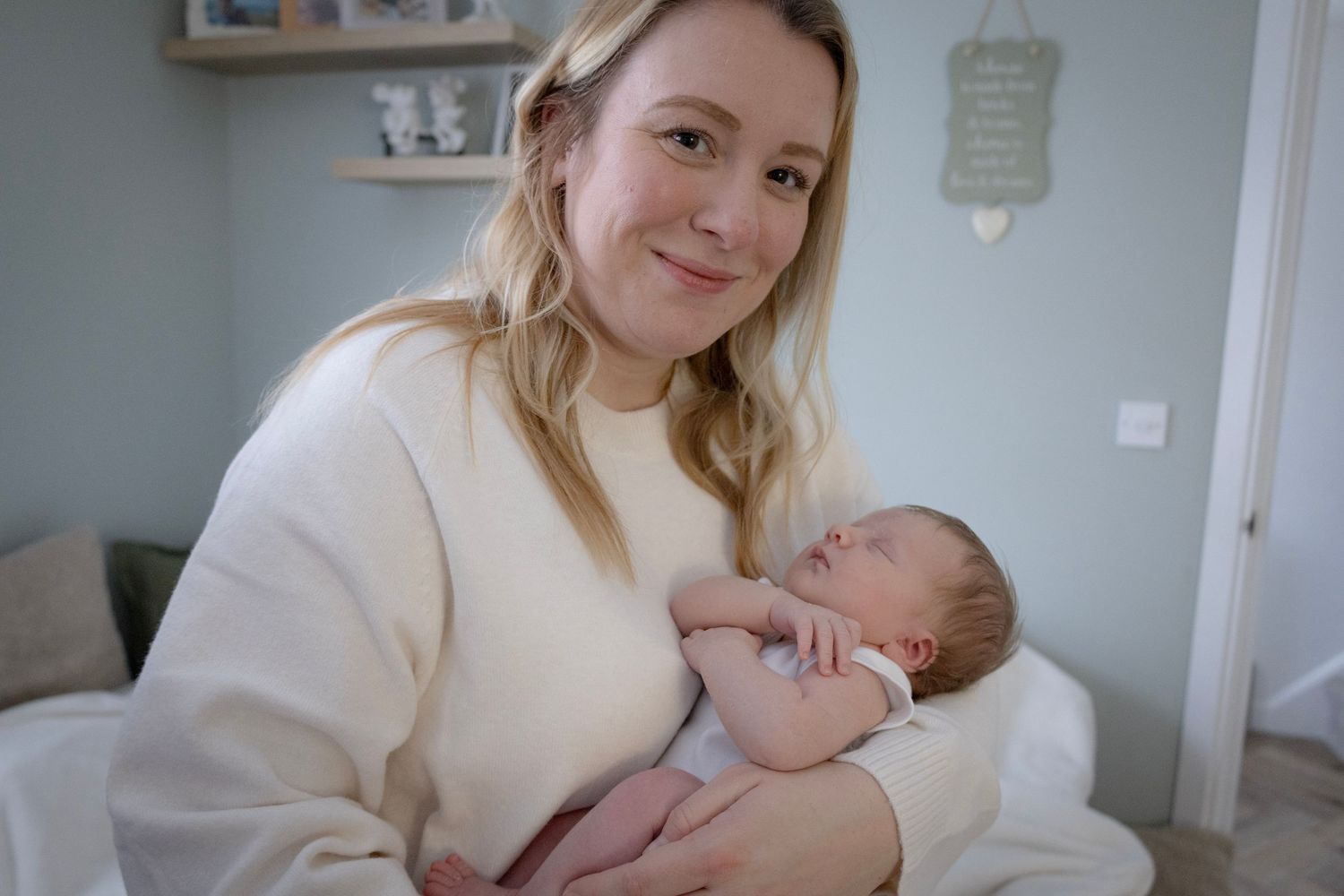 Mother holding a newborn baby.