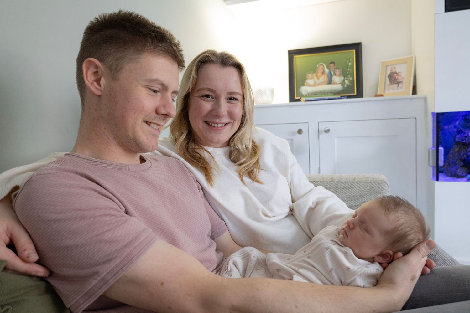 Mother and Father with 3 week old baby.