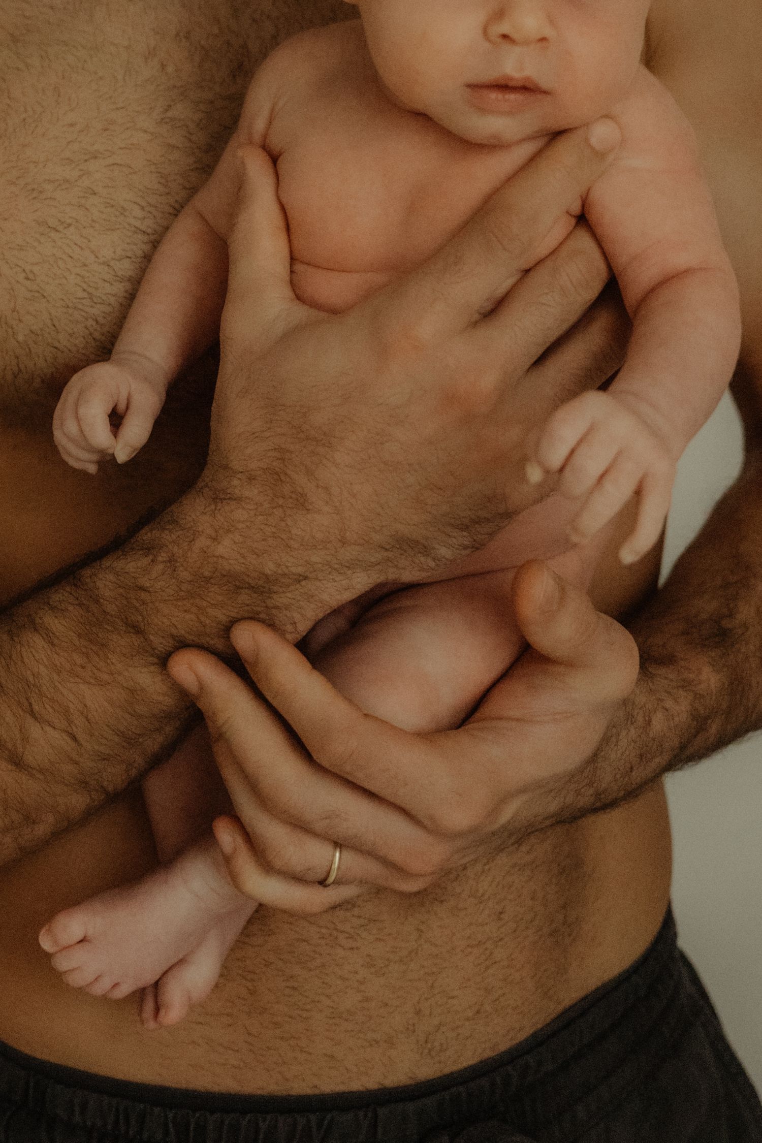 Close-up photograph of a baby resting on a furry blanket.