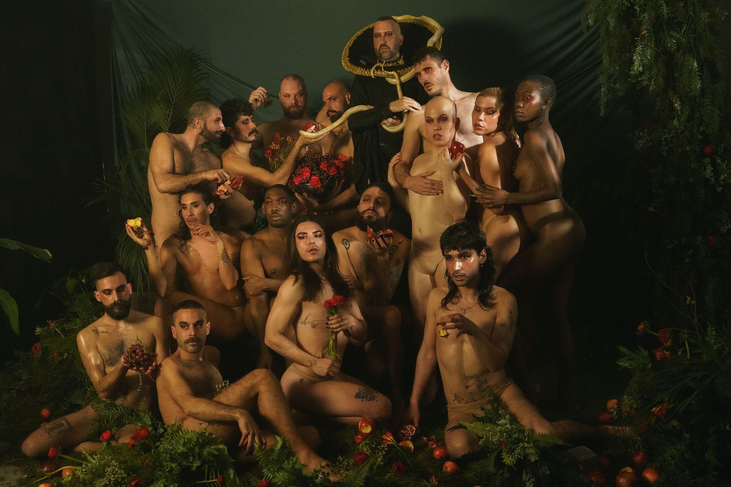 Artistic group photo with dramatic lighting in jungle-themed setting.