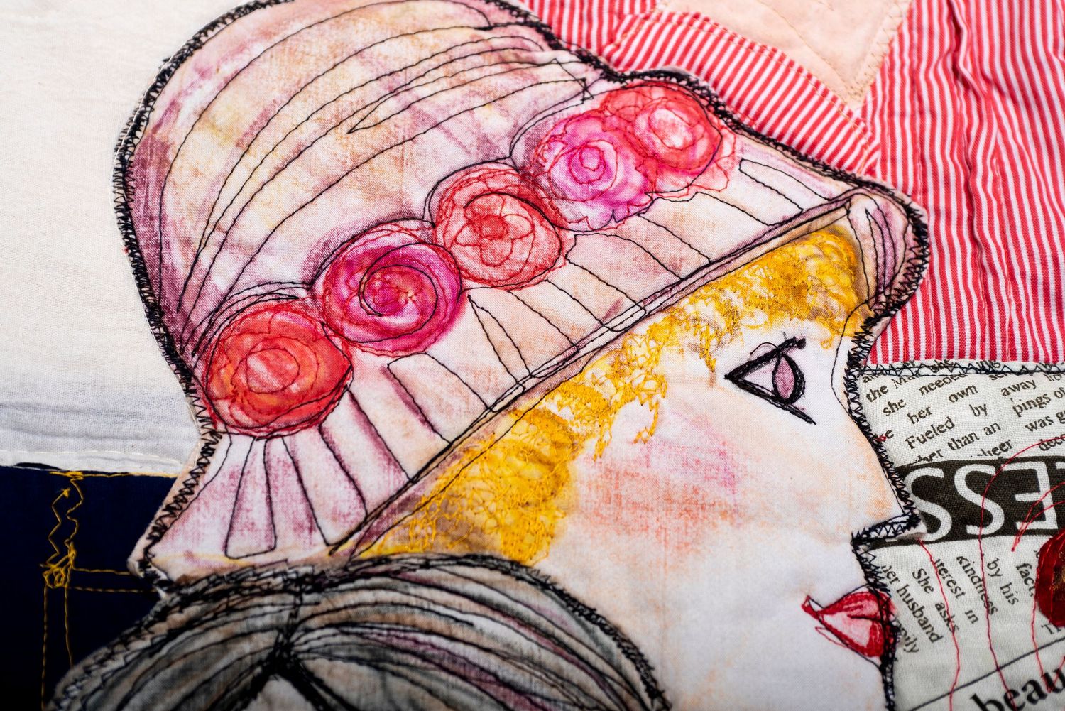 Close-up detail of pink and yellow watercolor artwork with delicate line work and floral motifs.