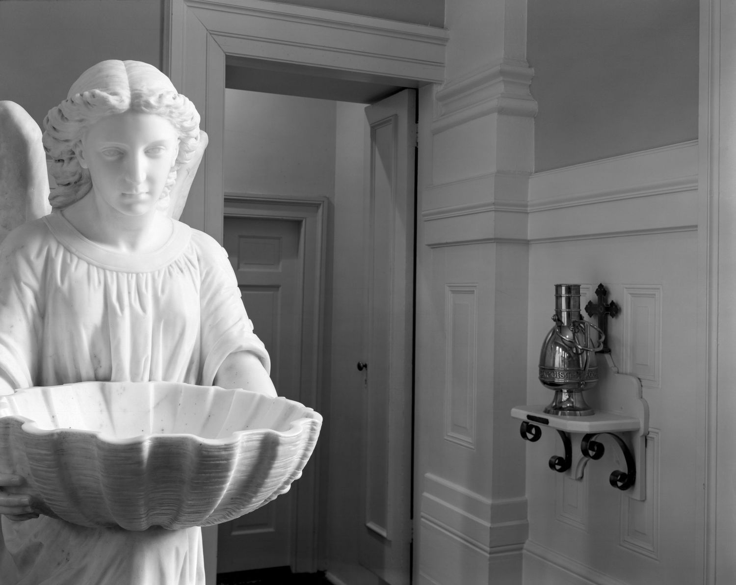 A black and white architectural of Christ Church Savannah highlighting large angel baptismal font