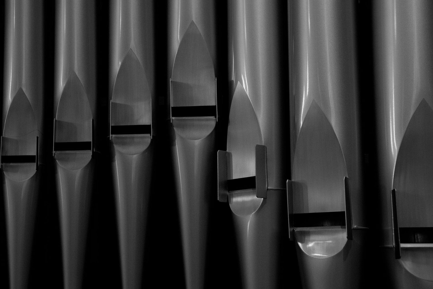 Close-up view of church organ pipes arranged in vertical rows creating a geometric pattern. John's Episcopal Church Georgetown Washington DC