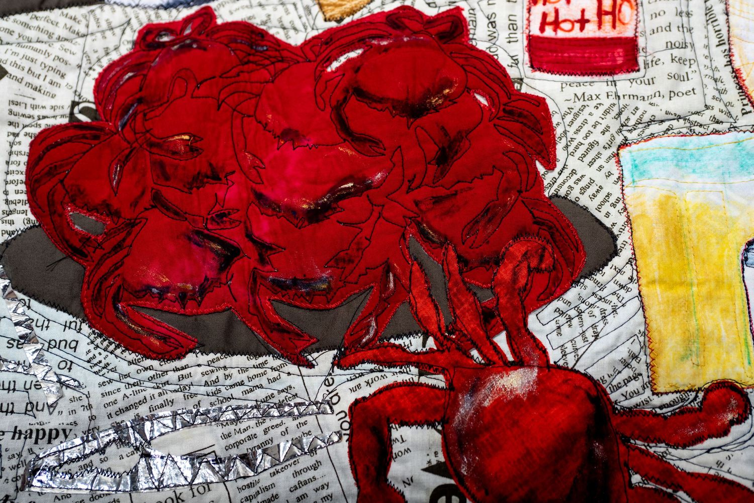 Close-up detail showing cooked Maryland crabs on newspaper