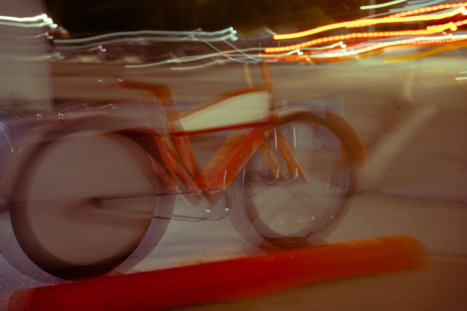Motion blur creates orange and white light trails across a dark scene.