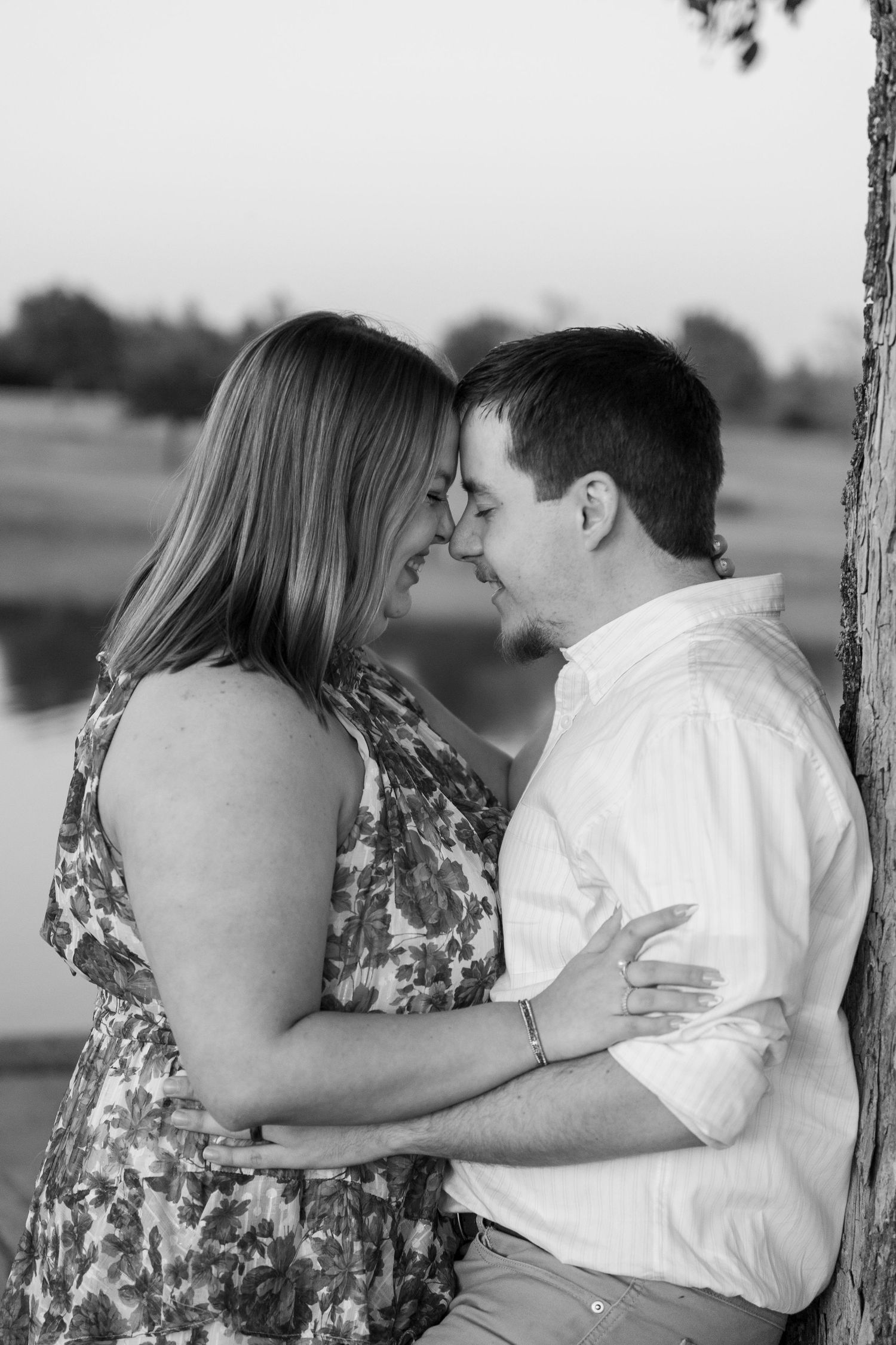 Black and white romantic photoshoot showing intimate moments between a couple on a swing.
