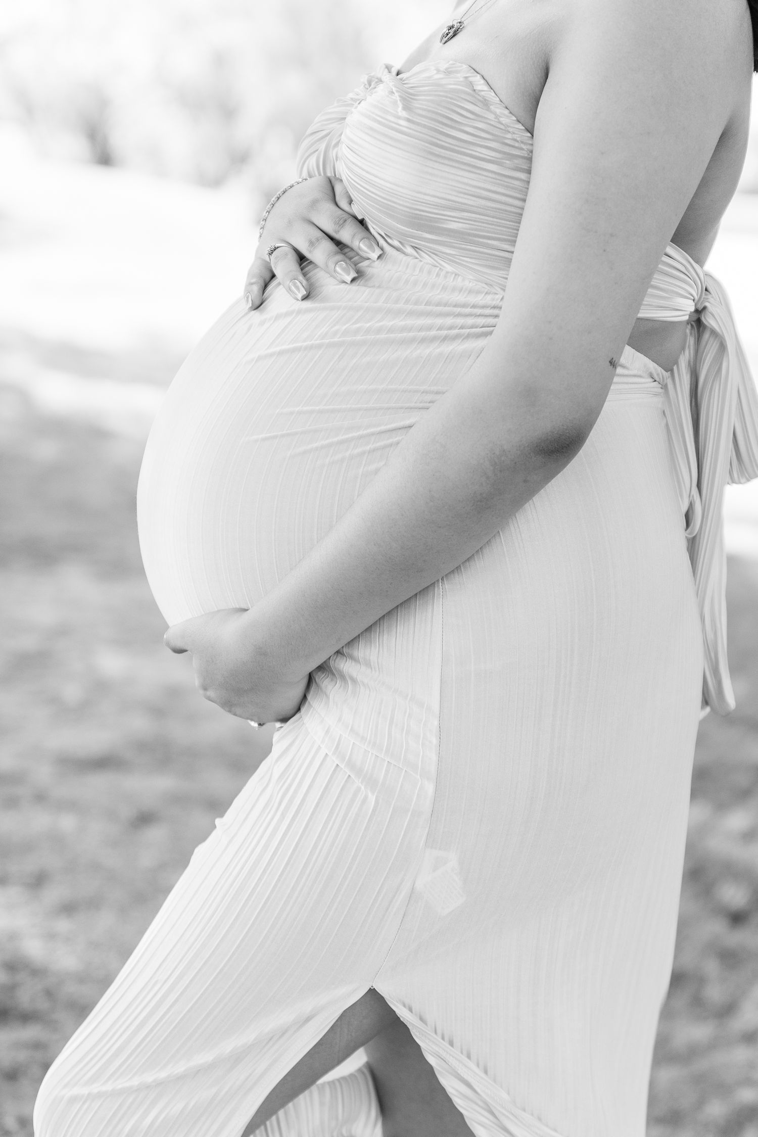 Series of side profile shots highlighting a growing baby bump in white dress.