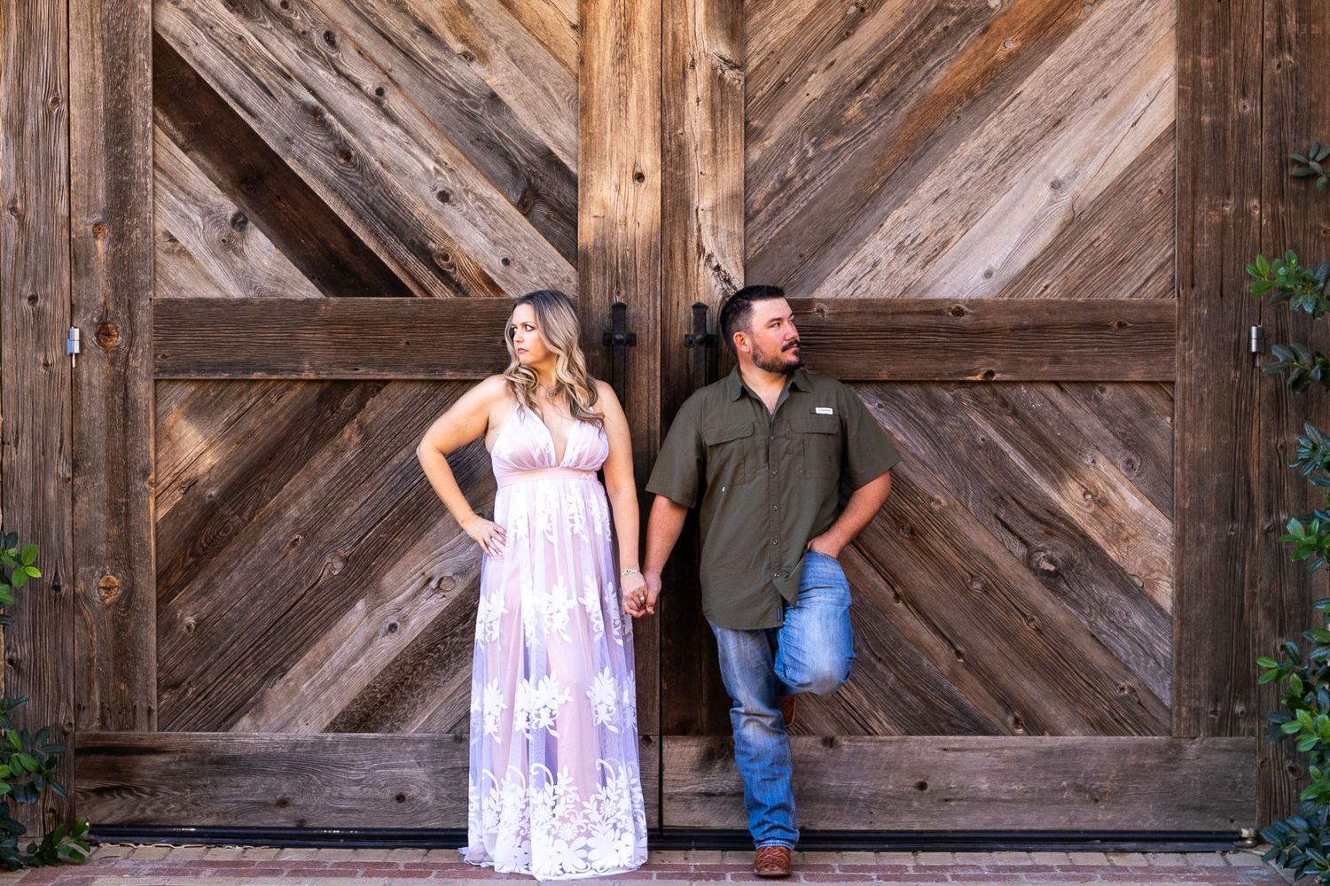 A series of romantic poses against a wooden barn door background.