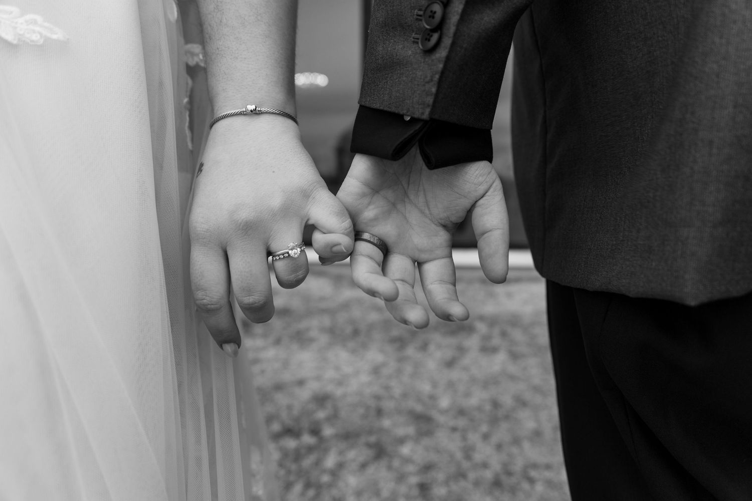 A sequence of wedding ring detail shots showing hands exchanging rings during a ceremony.