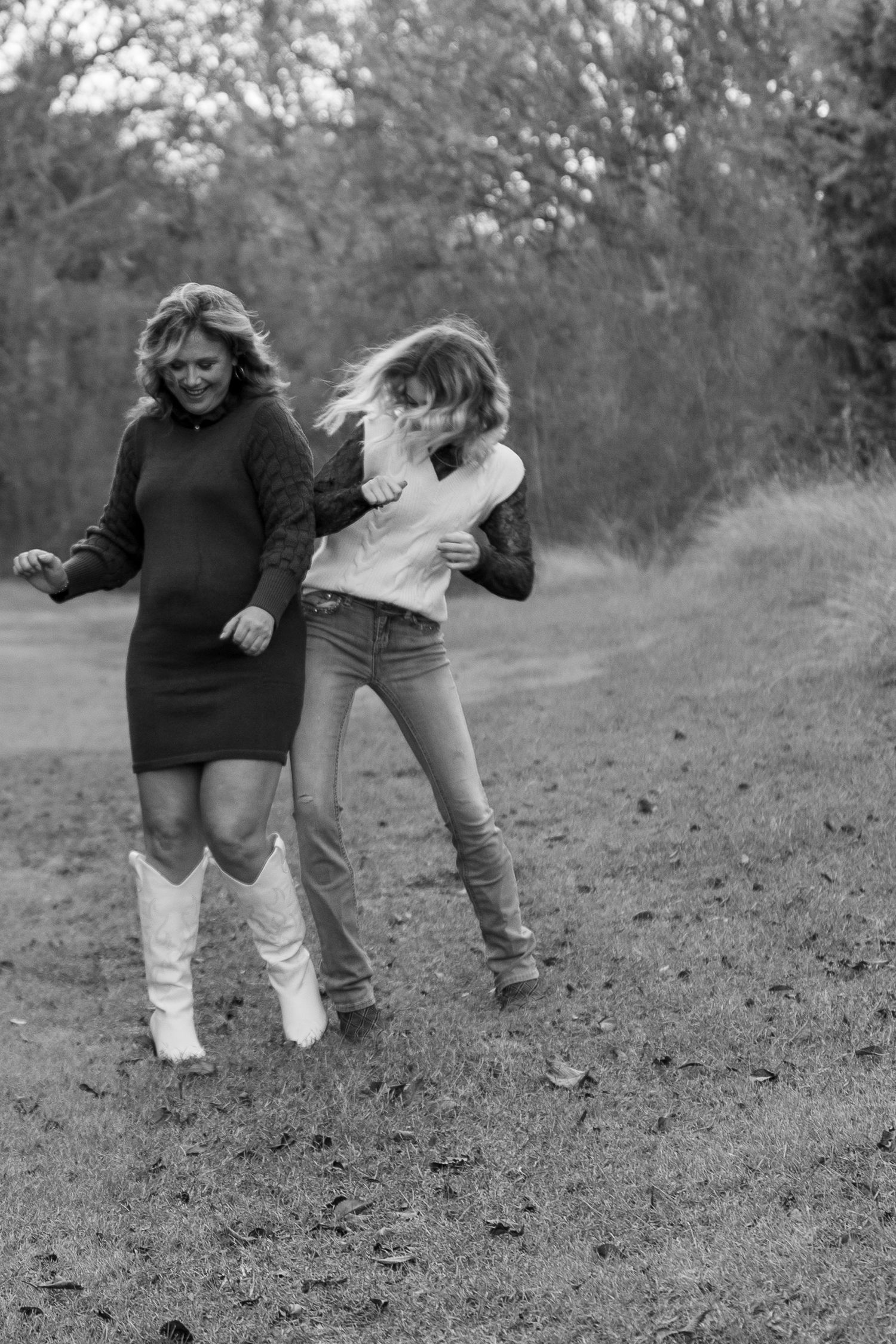 Black and white sequence showing people walking and playing on a hillside.