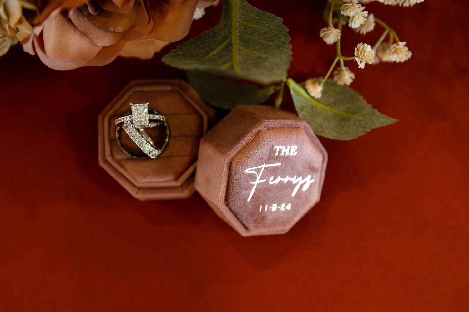 Wedding reception table details with elegant floral arrangements and place settings.