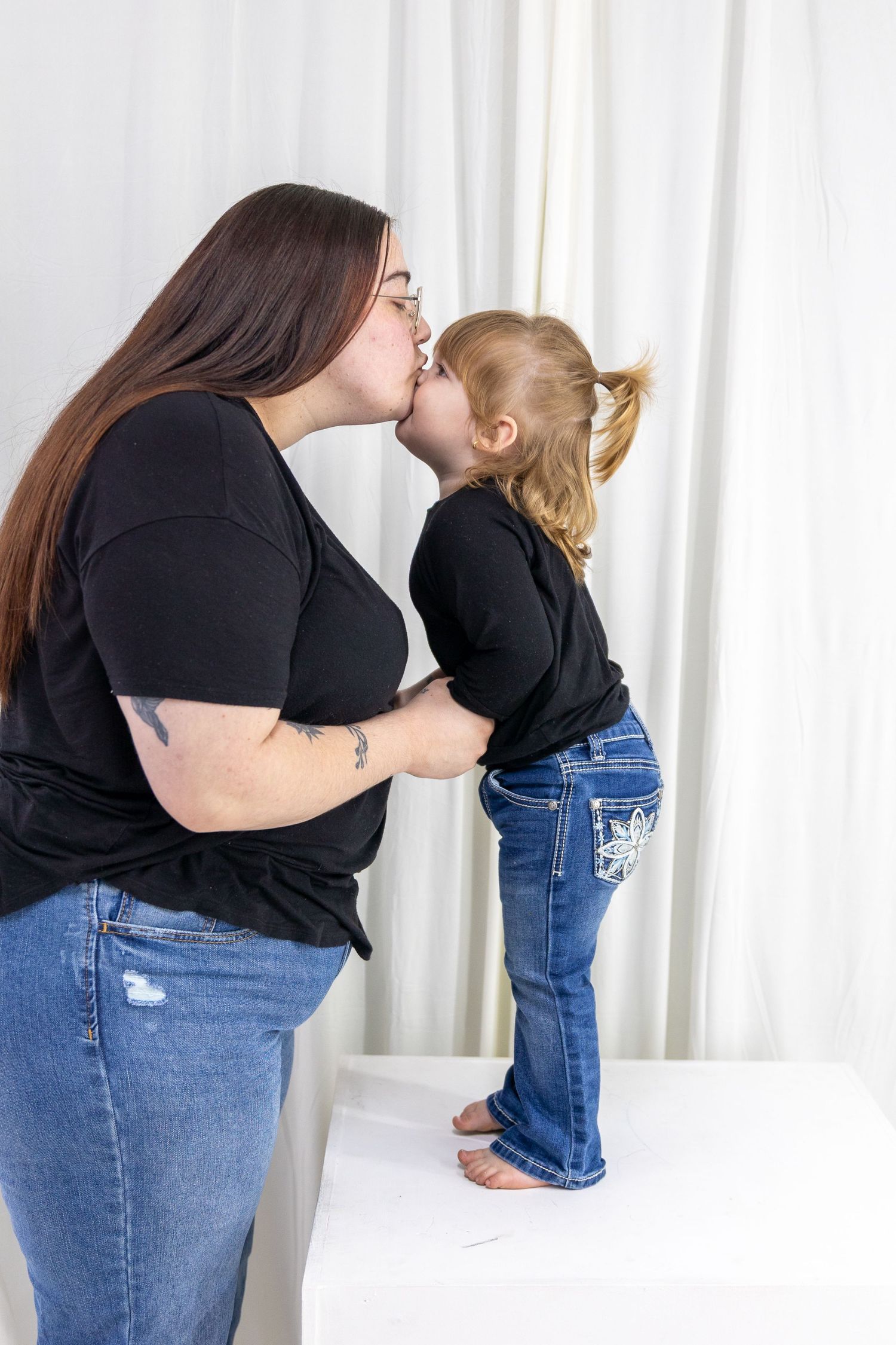Progression of pregnancy announcement photos showing growing baby bump.