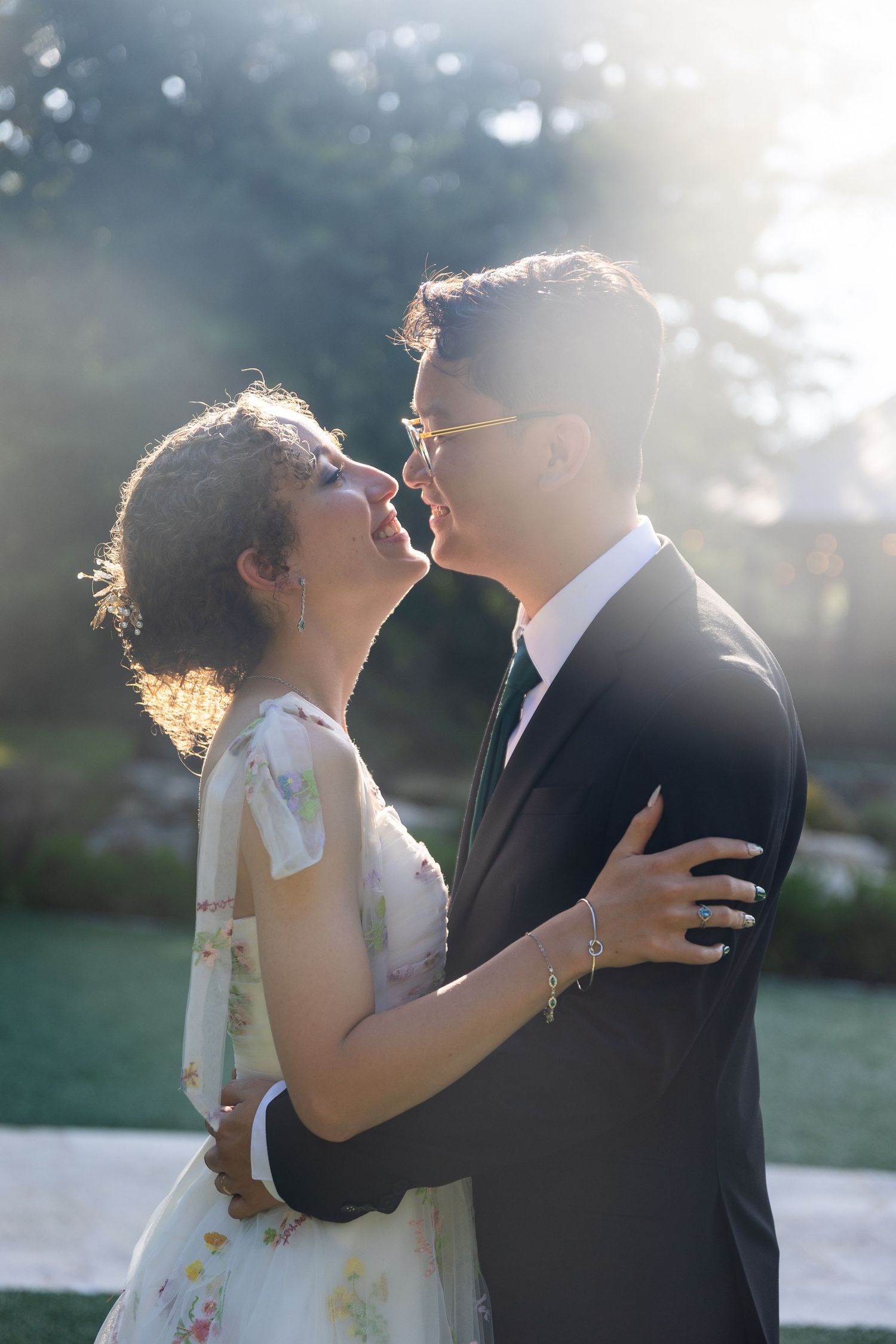 Romantic outdoor wedding moment captured in soft natural lighting.