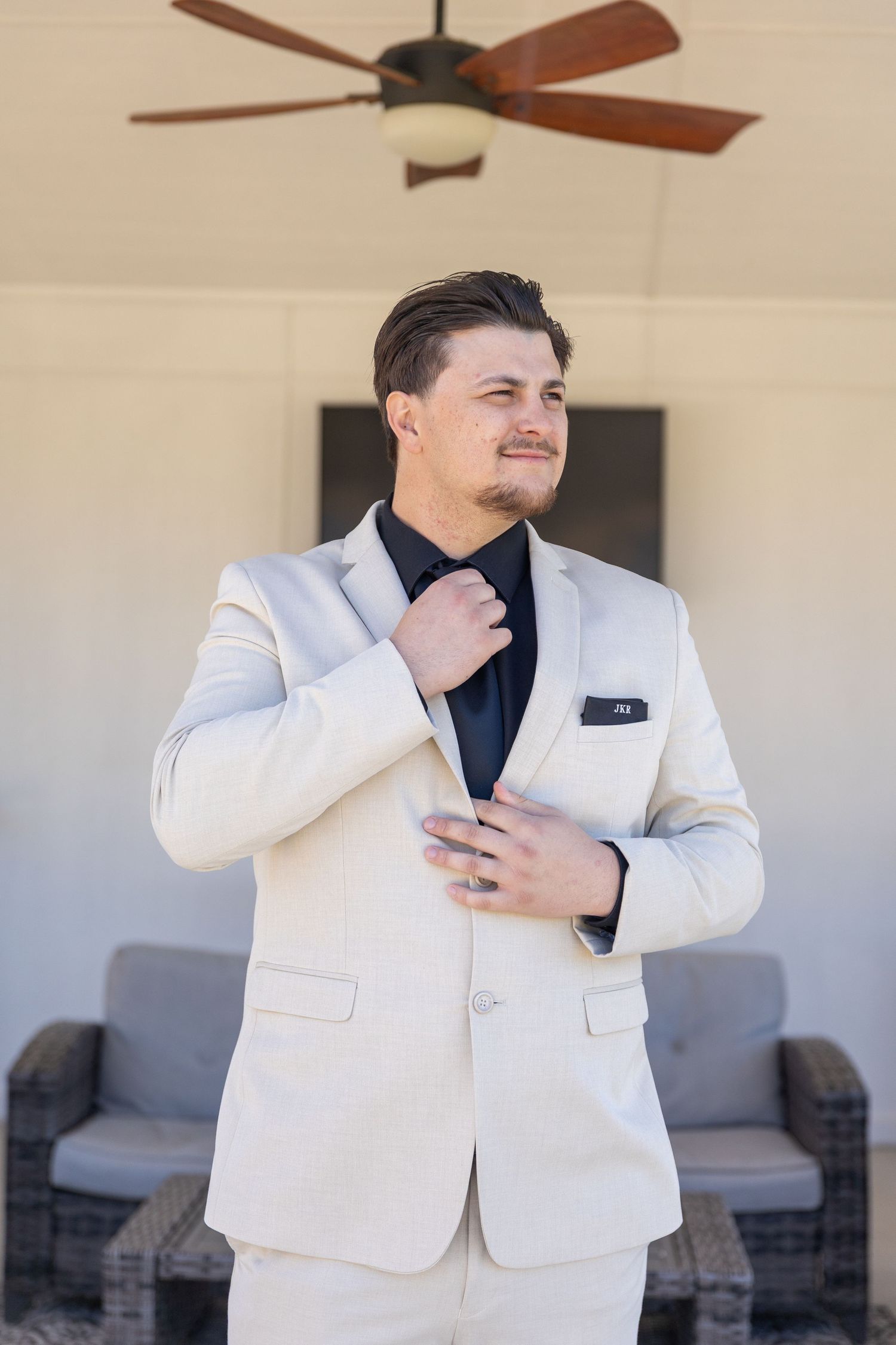Sequence of emotional reactions in white formal attire against light interior background.
