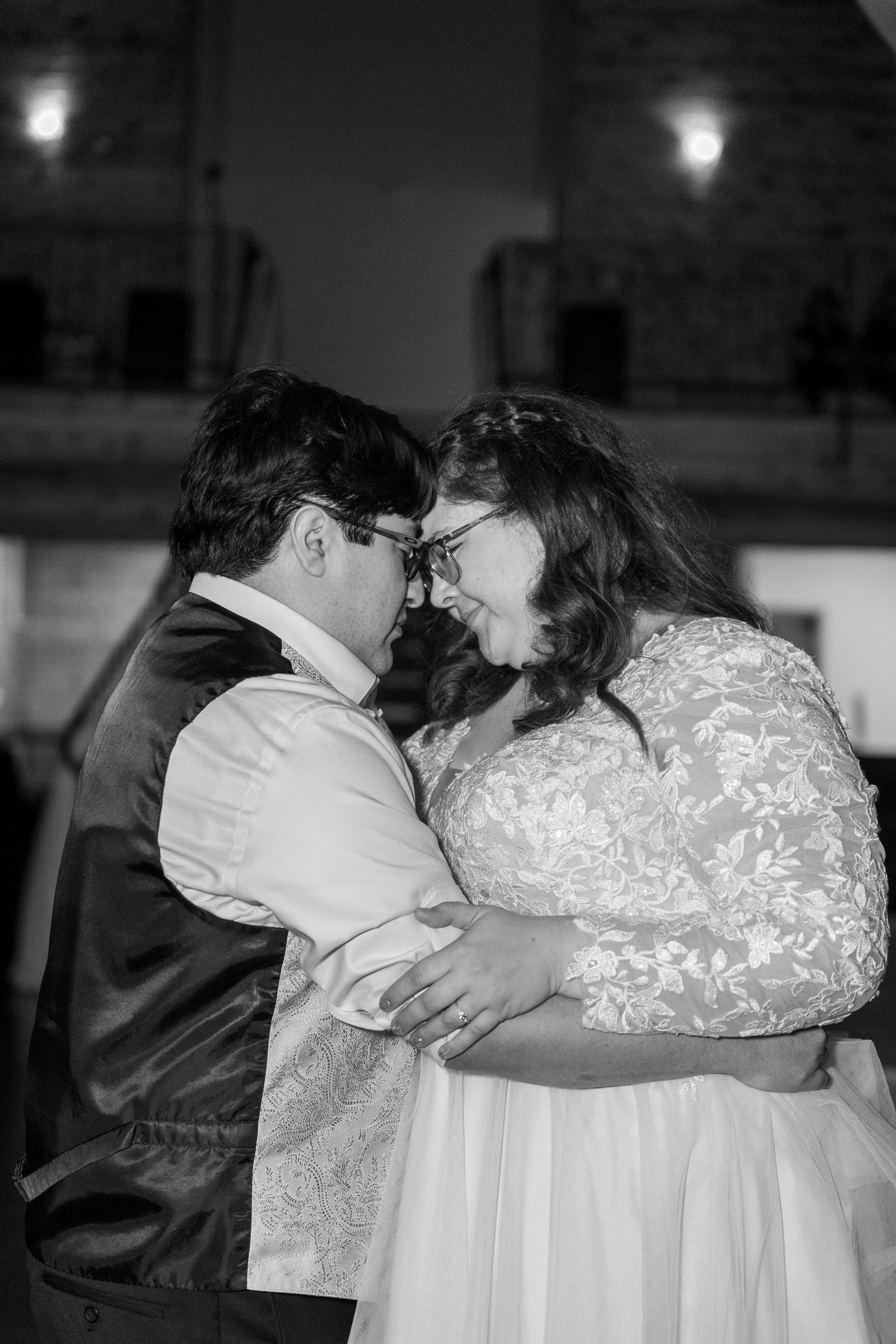 Black and white photo sequence of an intimate wedding moment.