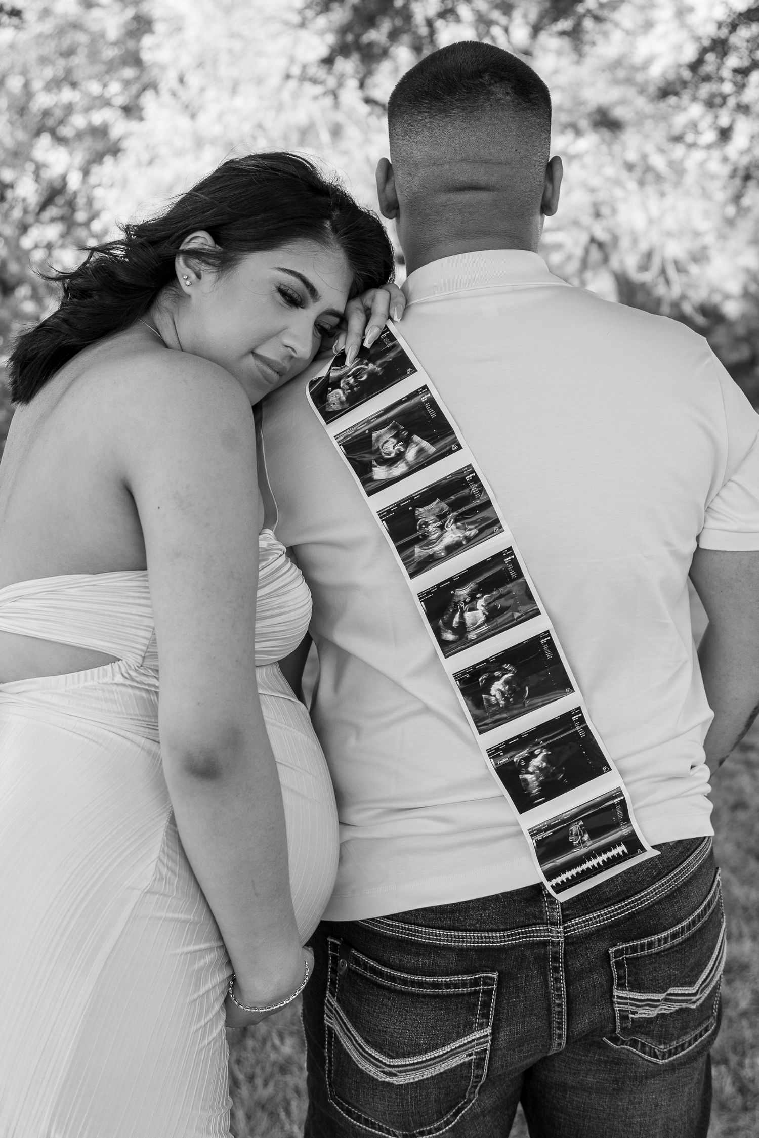 Black and white maternity photos with ultrasound images displayed.