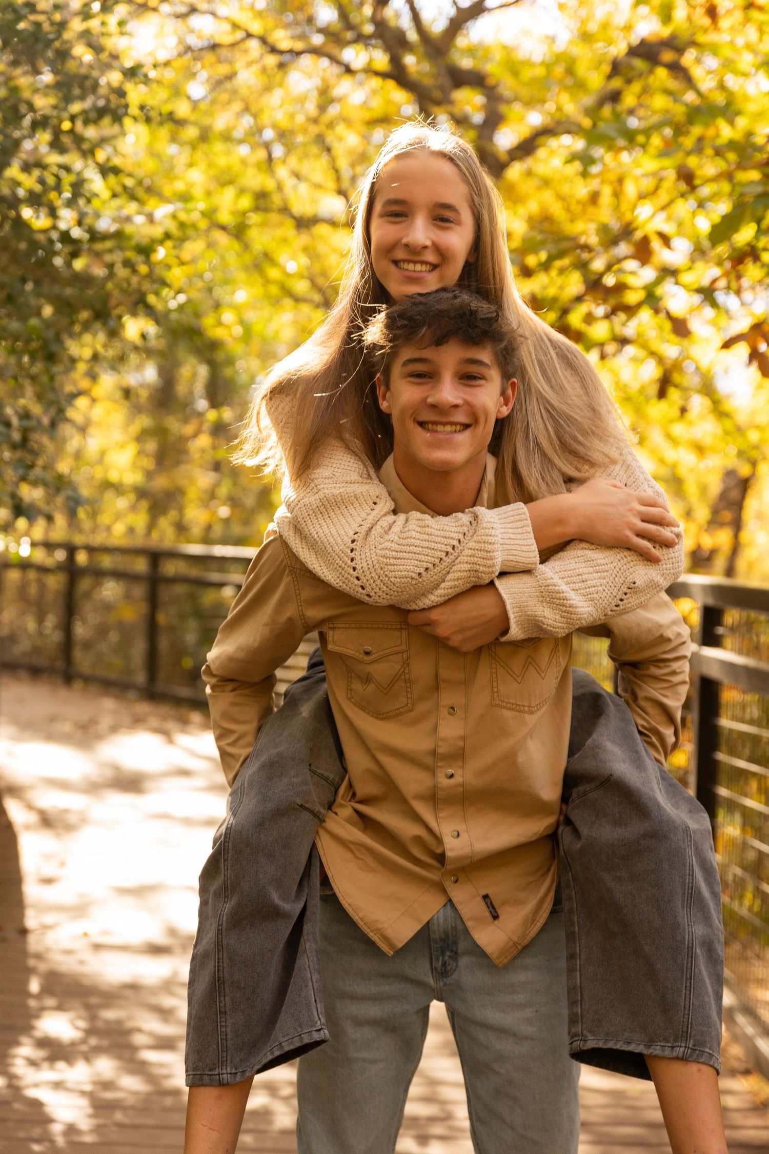 Playful piggyback rides captured in sequence on wooden walkway during golden hour.