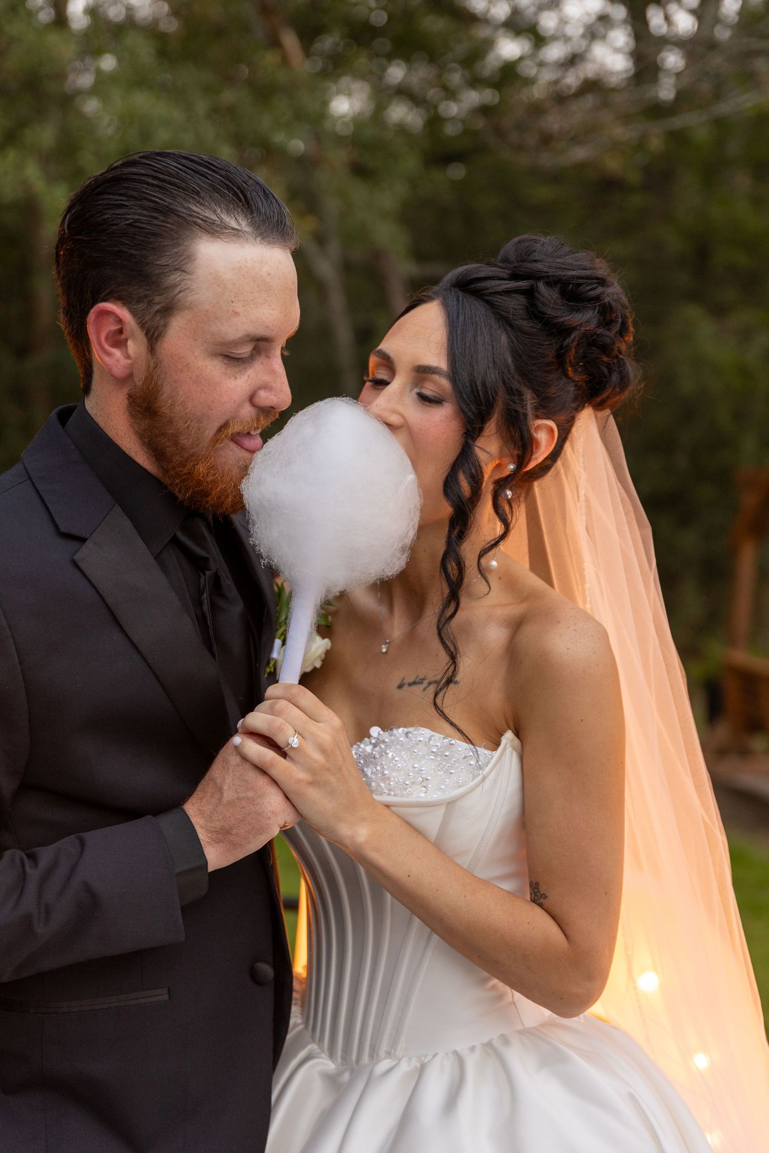 Couple shares romantic moment with smoke effects during sunset wedding photoshoot.