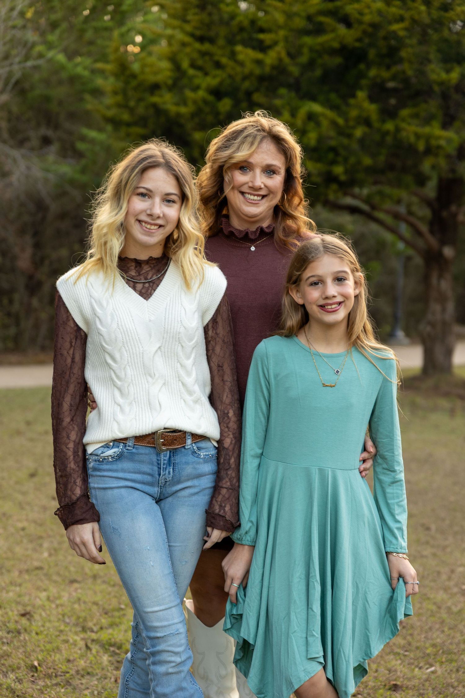 Group photo sequence outdoors with people wearing casual fall attire and bright sweaters.