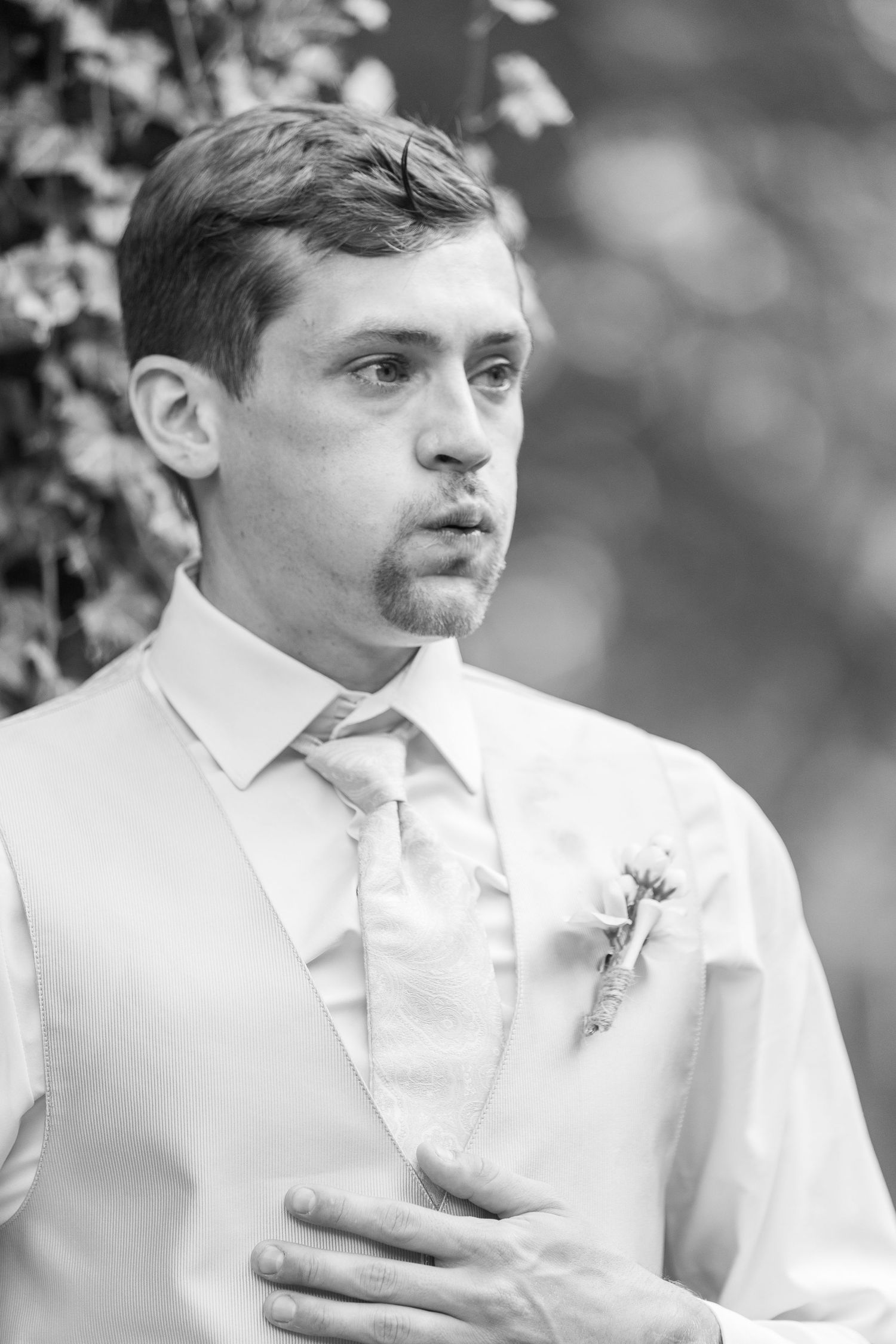 Black and white portrait series showing contemplative expressions in formal attire.