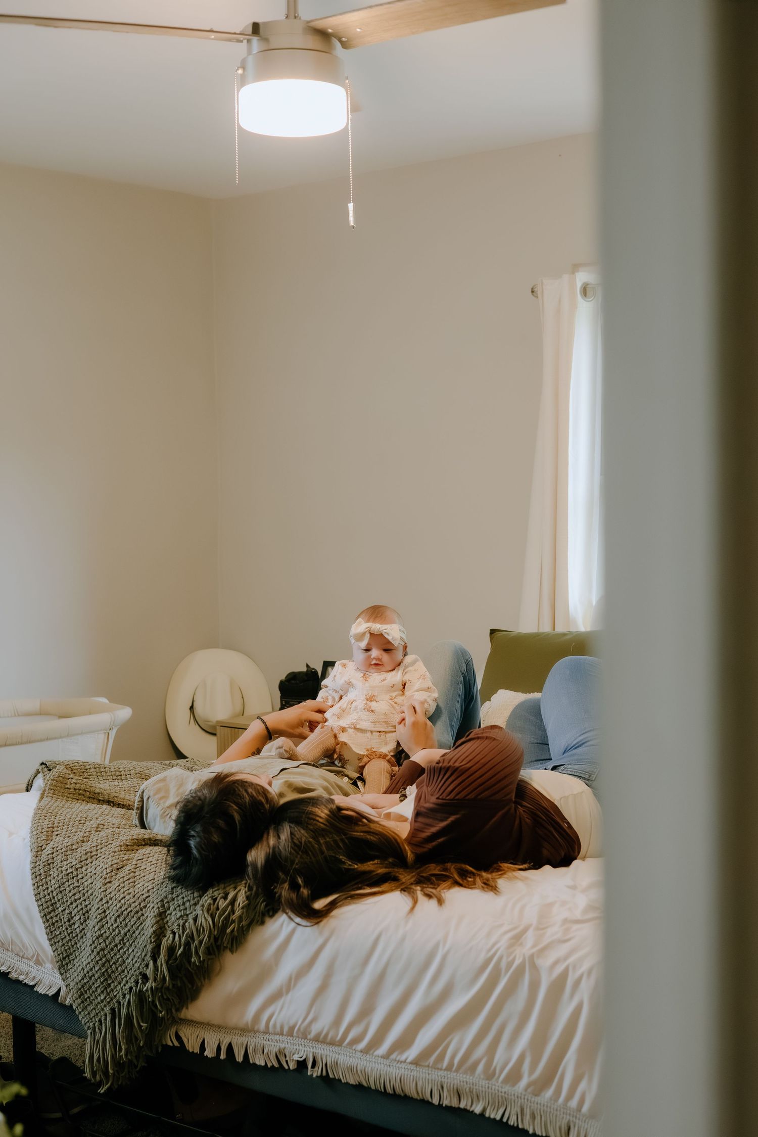 Restful scene in a bedroom with natural light streaming through windows.
