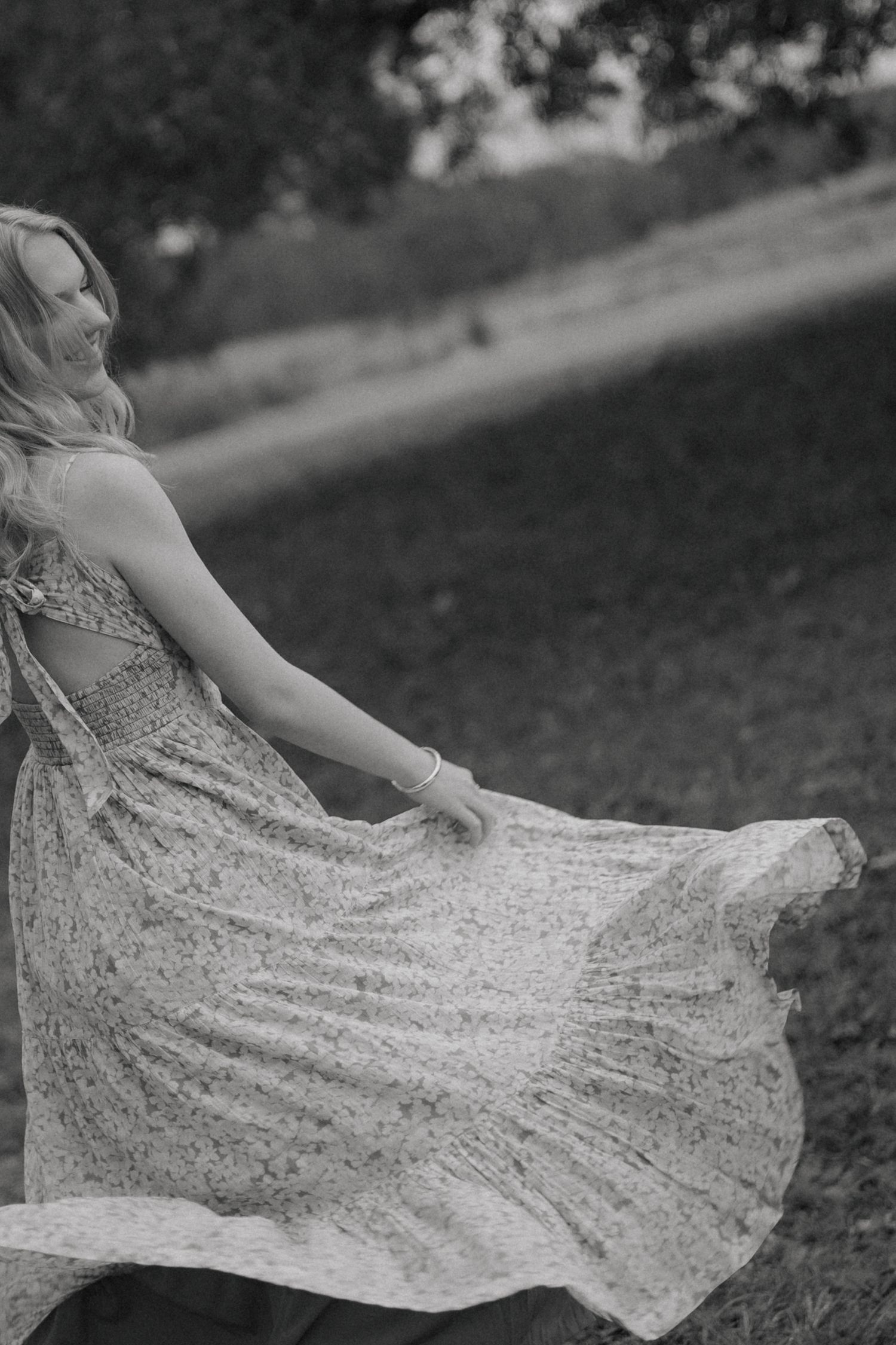 whimsical senior photoshoot in the fall girl spinning in flowy dress in gloucester, va shot by virginia senior photographer
