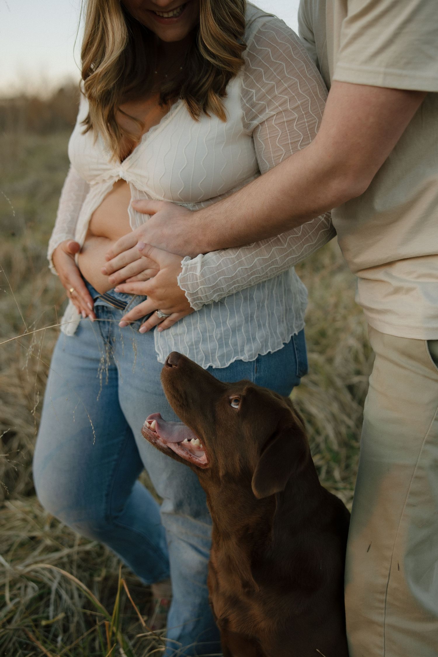 Pregnancy Announcement photoshoot at Machicomoco State Park with their dog in Gloucester, VA shot by a virginia photographer