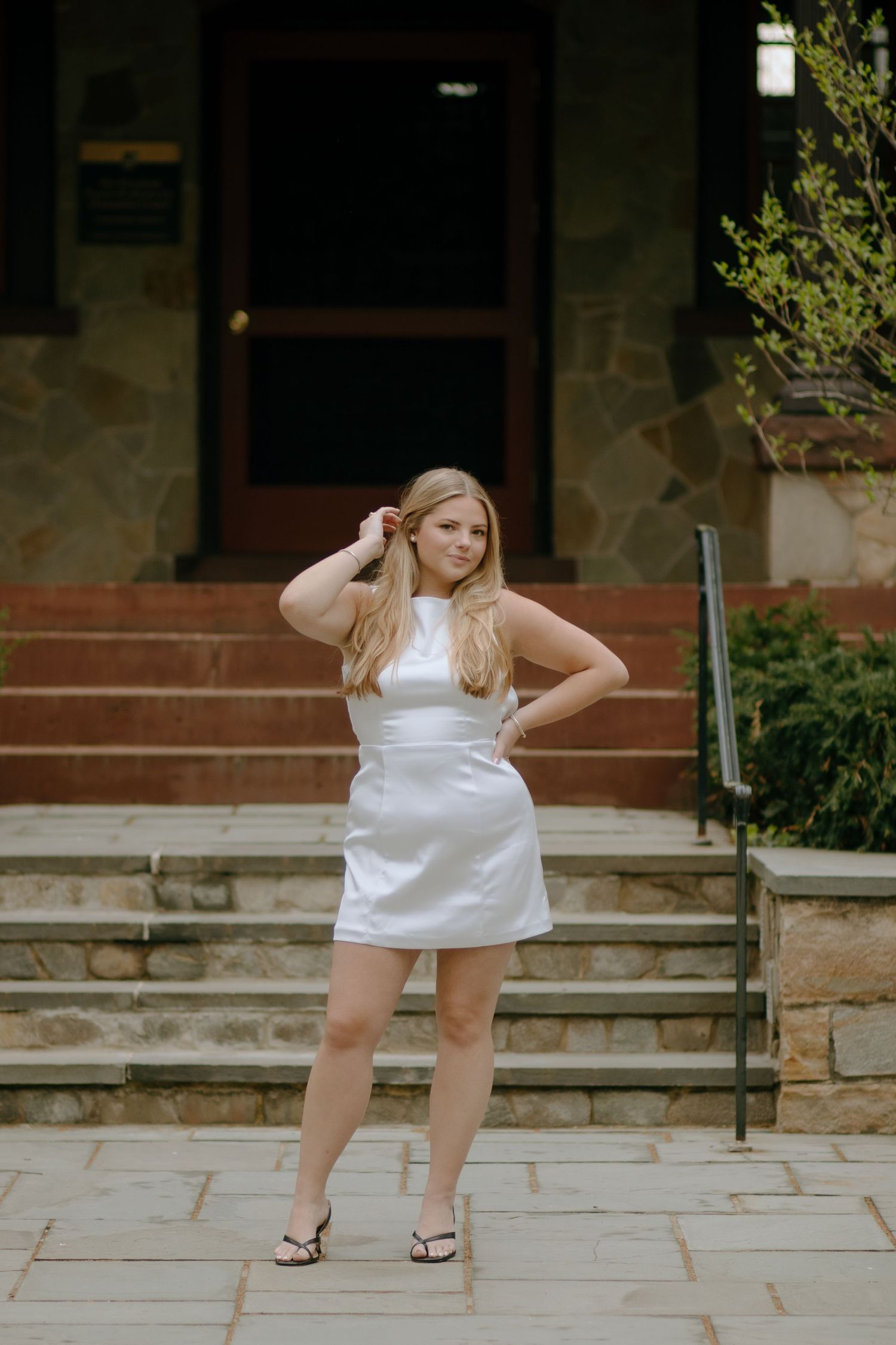 Dynamic poses captured on stone steps in front of a building entrance.