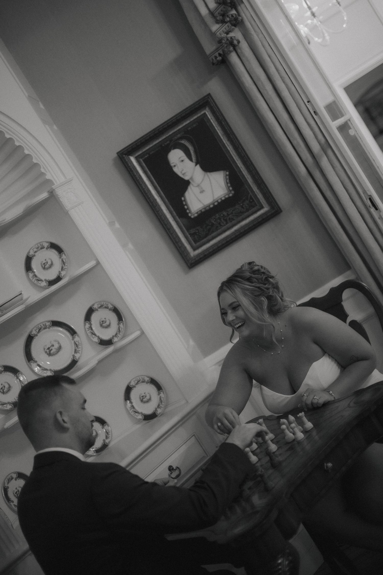 A series of black and white photos showing intimate moments between a couple during a romantic evening at home.