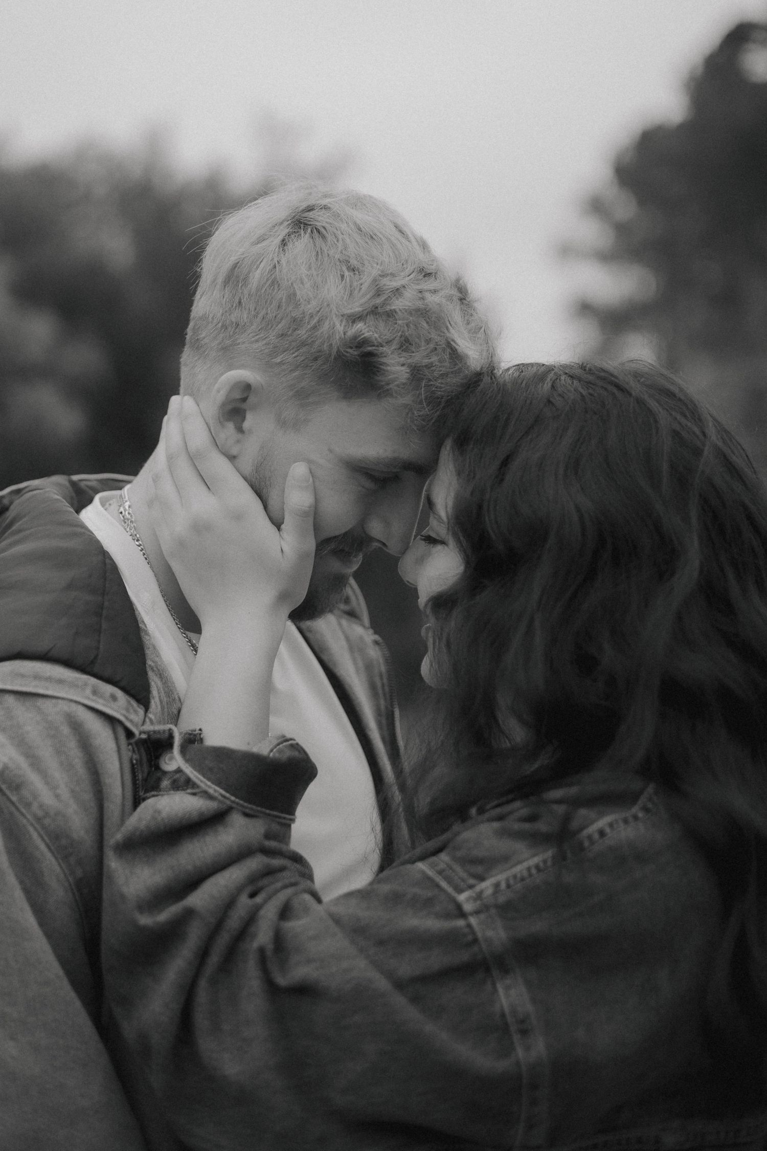 A romantic black and white photo sequence shows a couple sharing an intimate kiss in four progressive frames.
