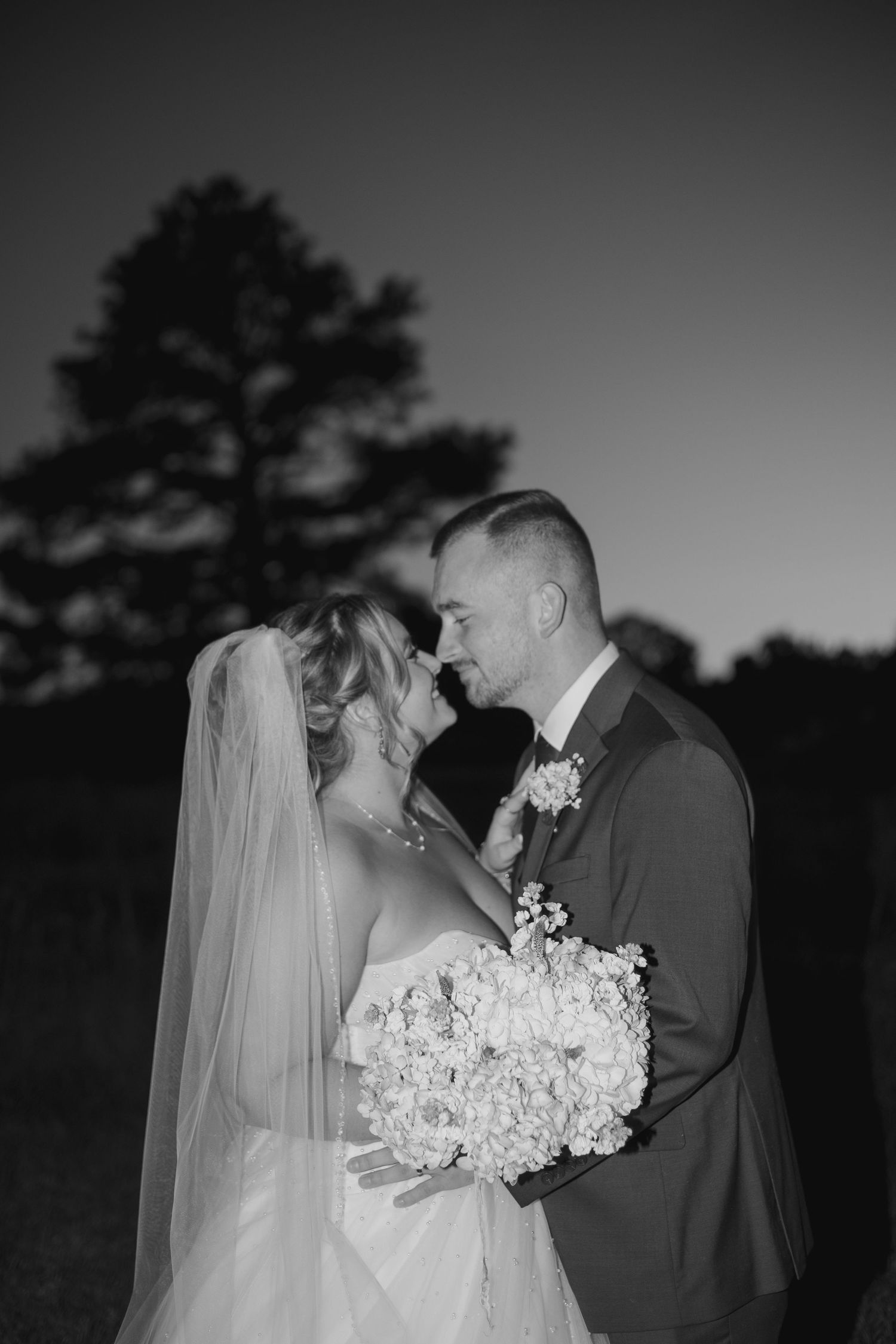 A romantic black and white wedding photo sequence showing a couple in an outdoor setting.