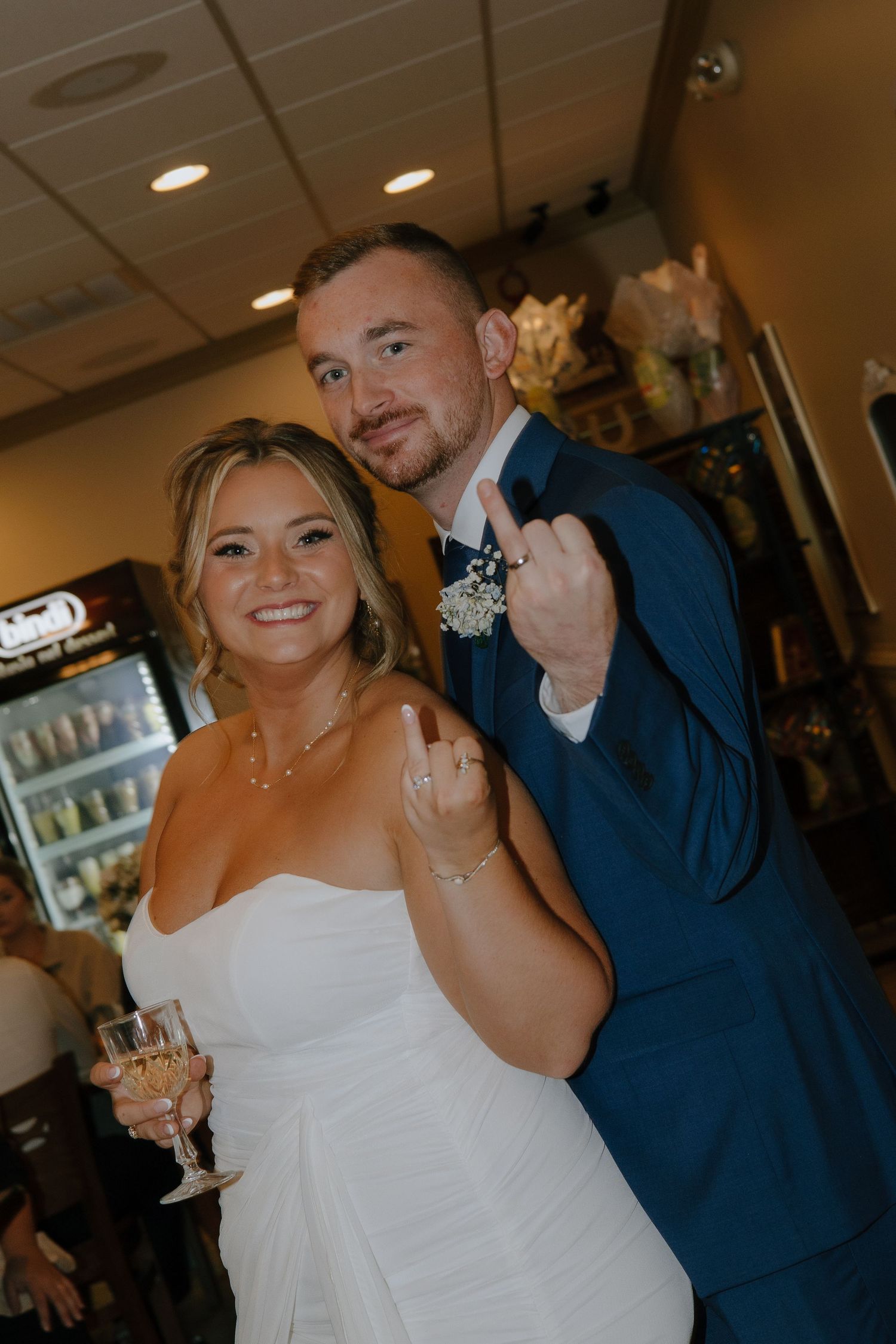 A celebratory moment at a wedding reception with champagne toasts and joyful expressions.