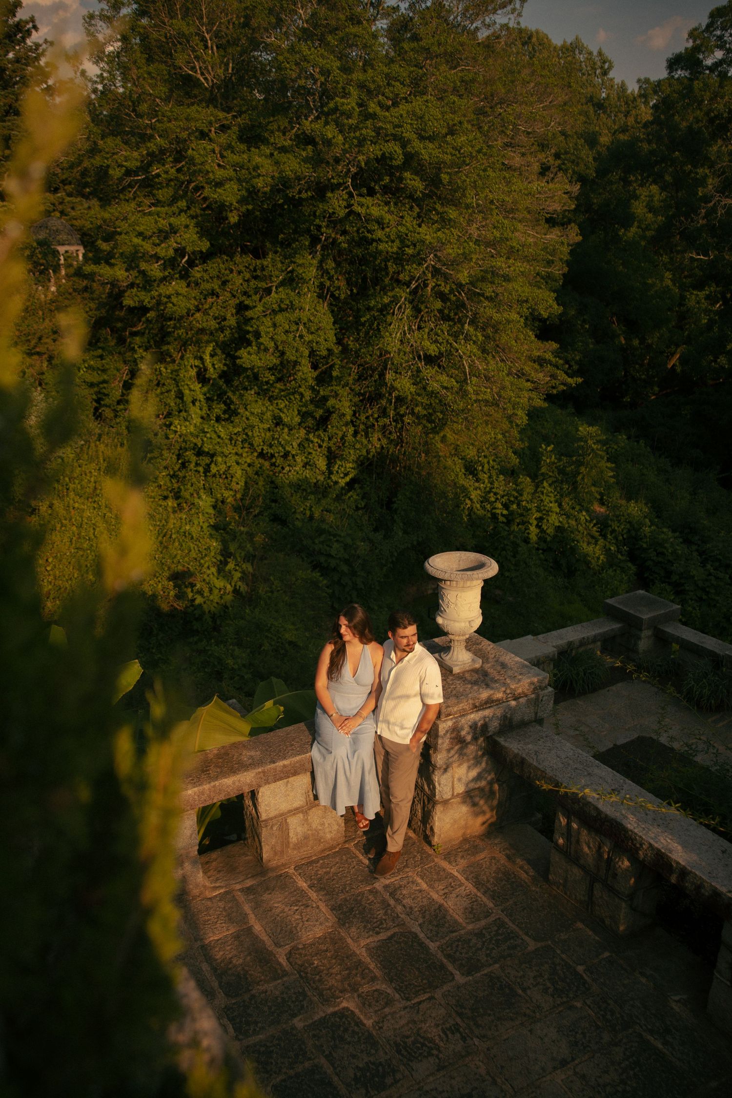 Couple standing on stone terrace at golden hour, Maymont in richmond, va. virginia engagement photographer