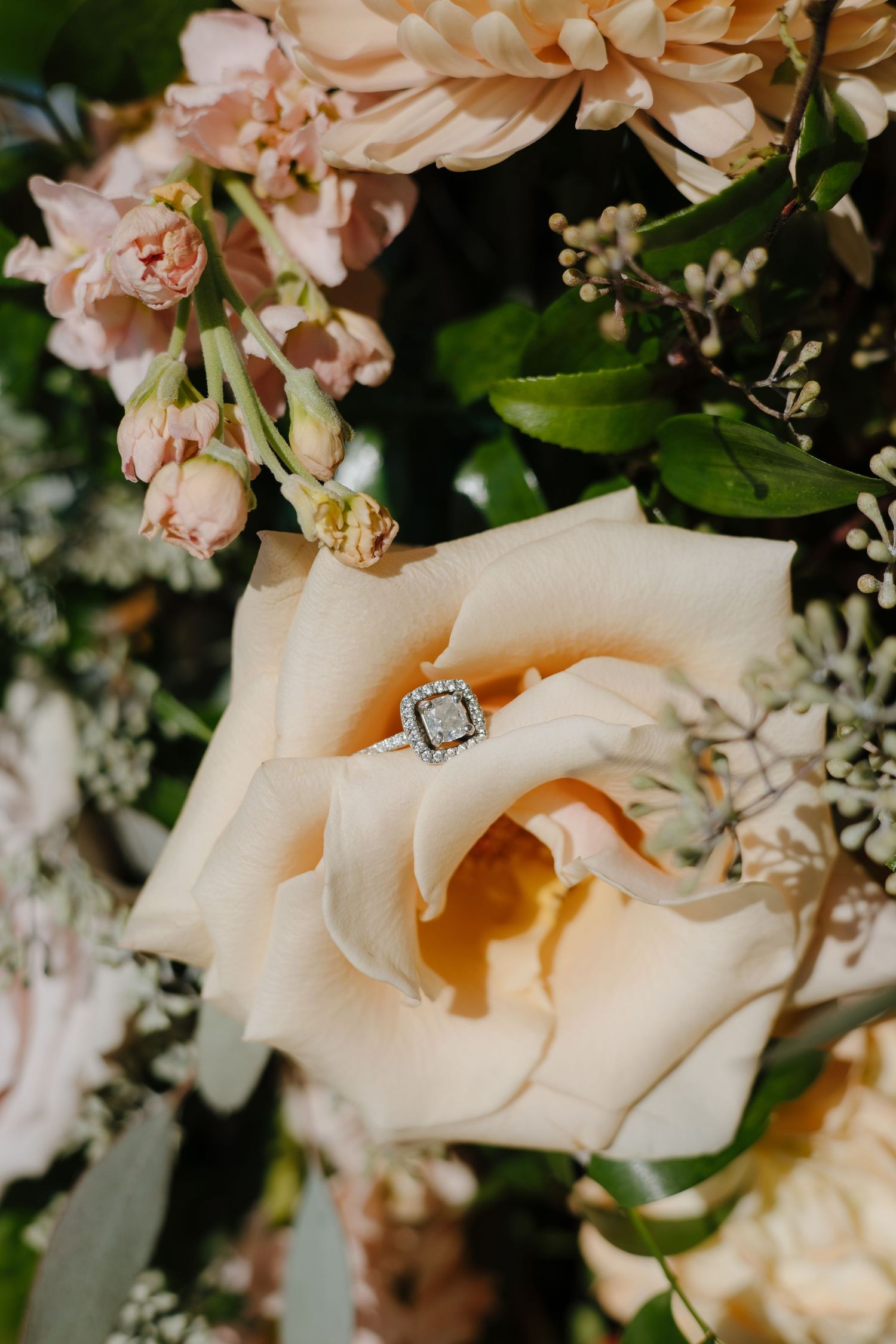 detail shot of wedding ring in flowers in Maryland captured by virginia wedding photographer