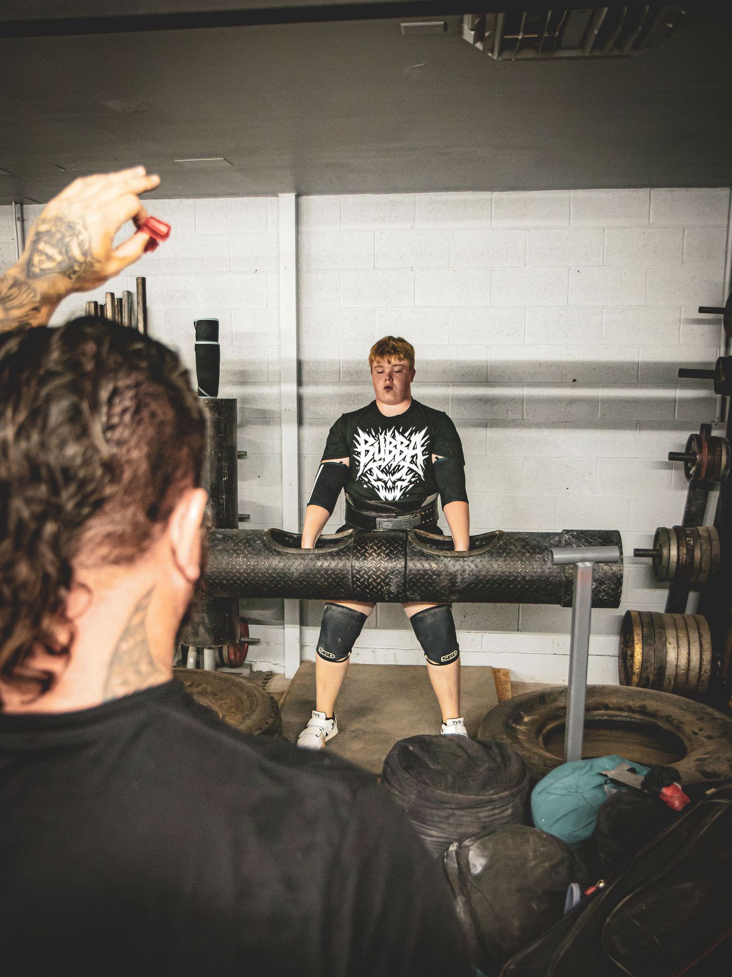 Strongman athlete Bubba Pritchett working on the log press